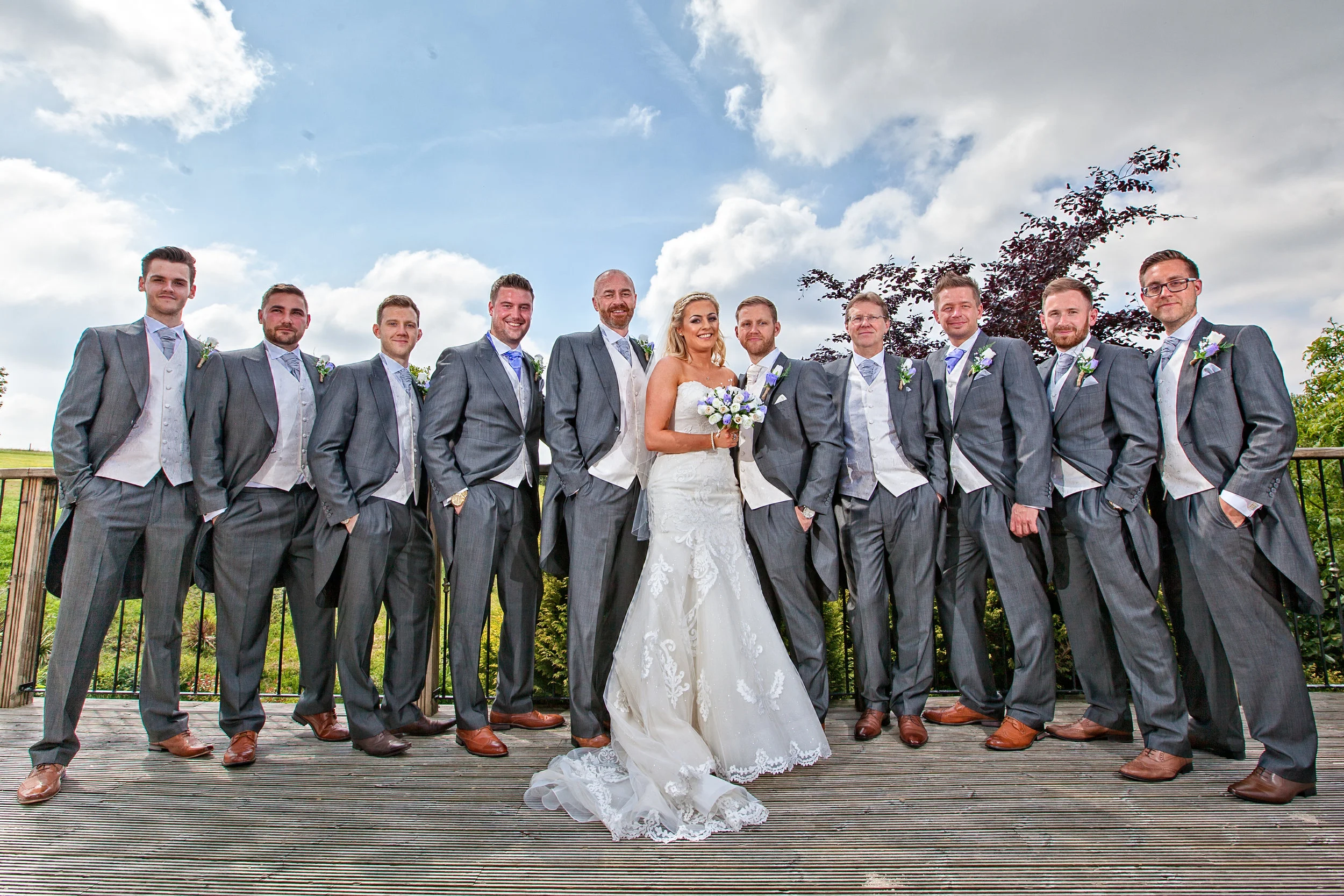 Newly weds with groomsmen at The Fisherman's Retreat Wedding Venue at Ramsbottom. Images by Avanti Photography covering UK weddings since 2010.