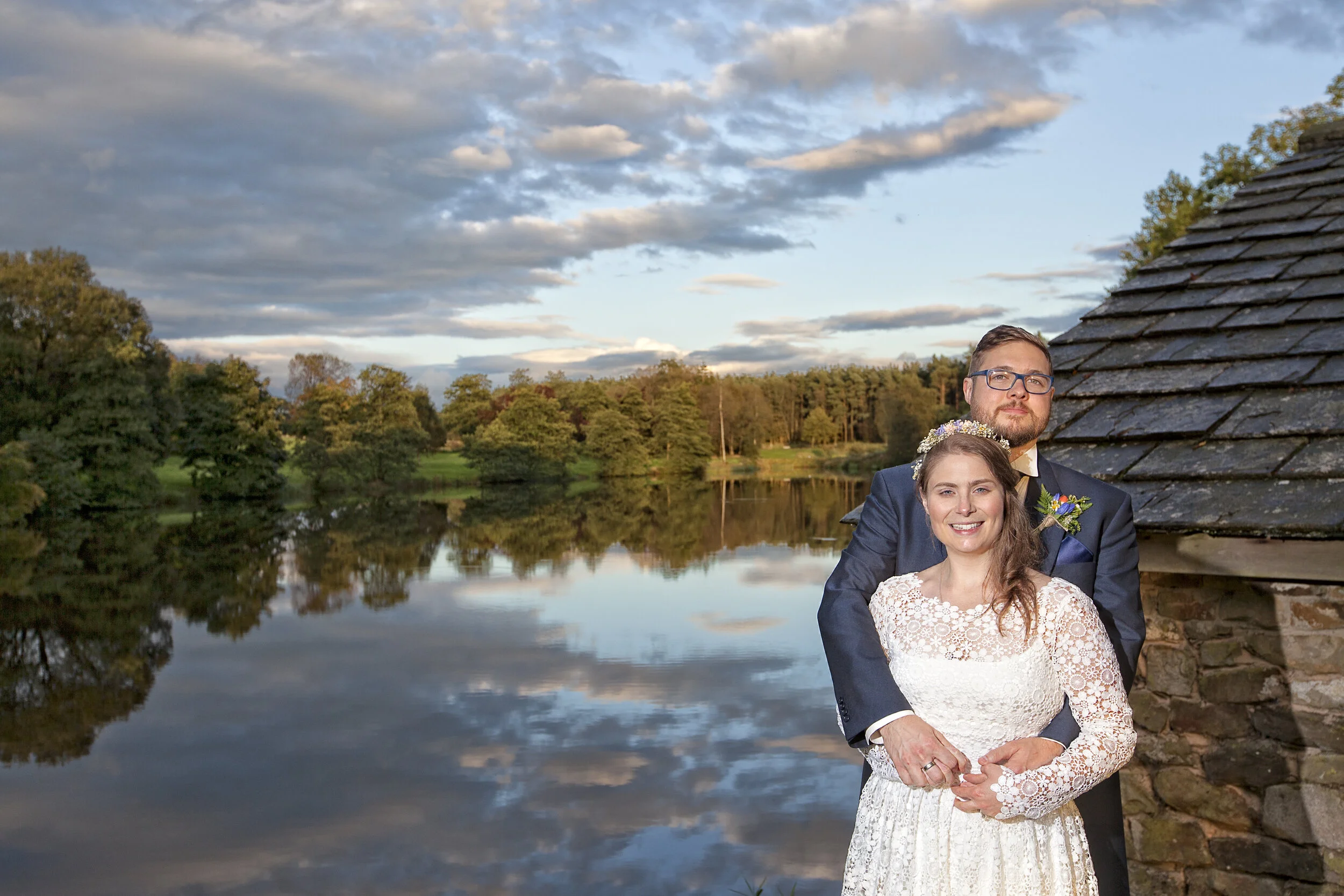 Shot by the Lake /bride and groom next to the  lake at The Tithe Barn,Trough of Bowland,Lancashire.