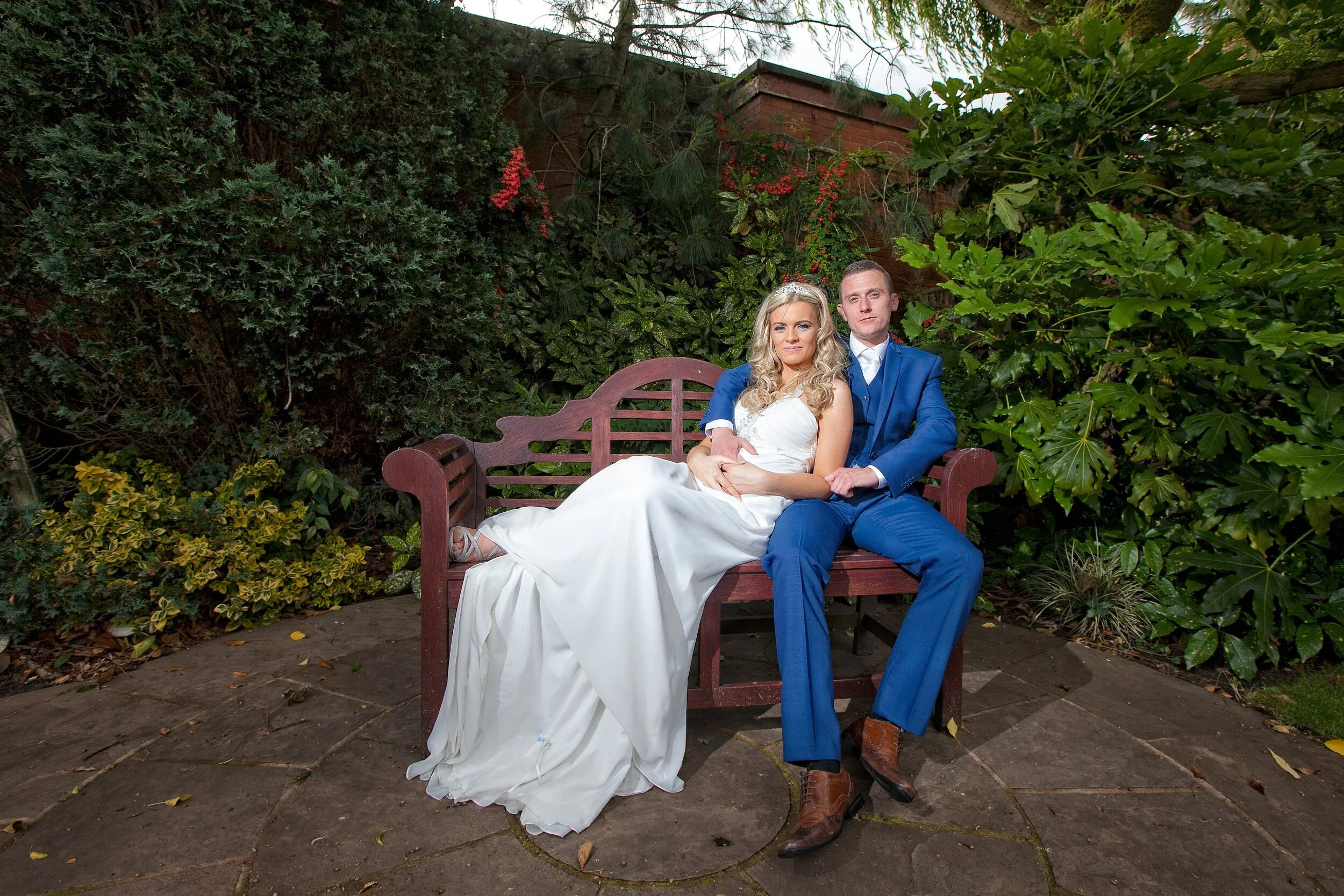  Newly weds relaxing in their wedding venues gardens.