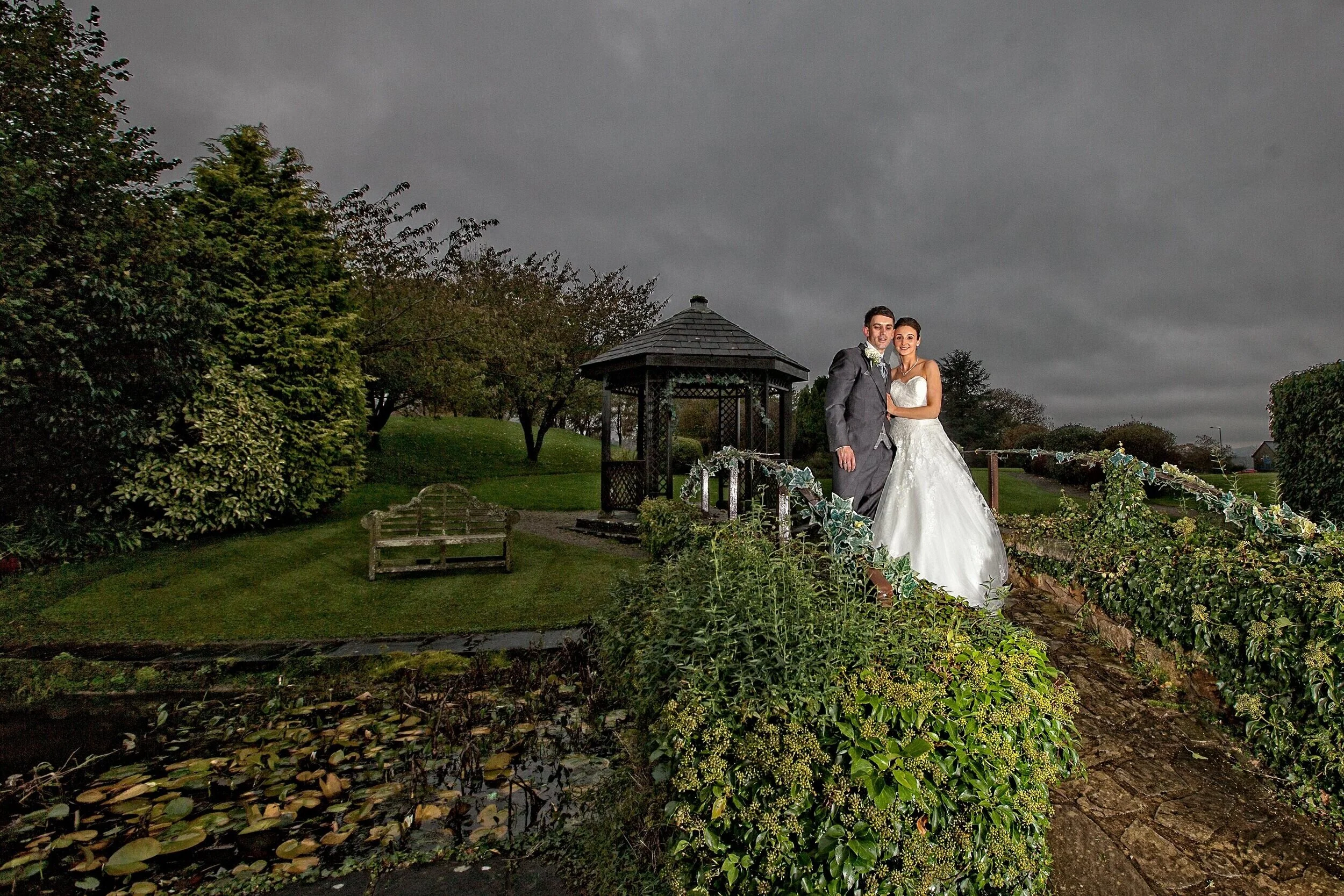 Newly weds pose outside of Mytton Fold in their garden.