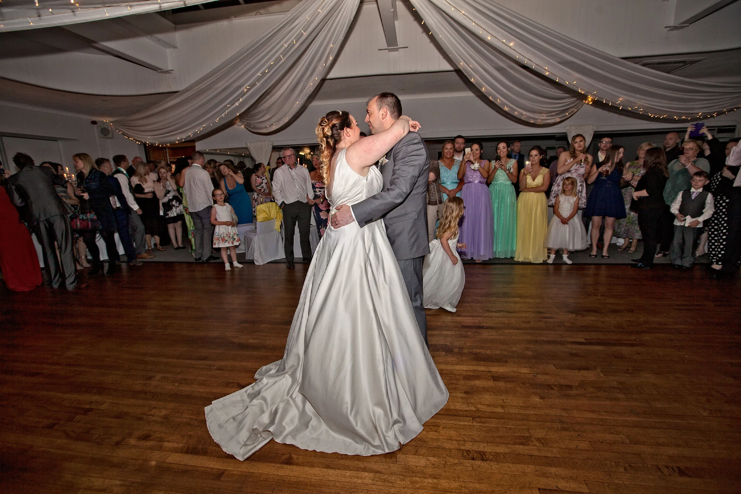 First dance of newlyweds infront of their wedding guests and family.