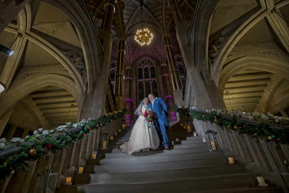 Newlyweds stop on The Grand Staircase in Rochdale Town Hall.
