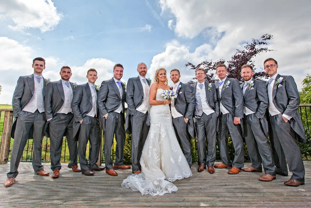 Bride and groom and his groomsmen at The Fishermans Retreat wedding venue