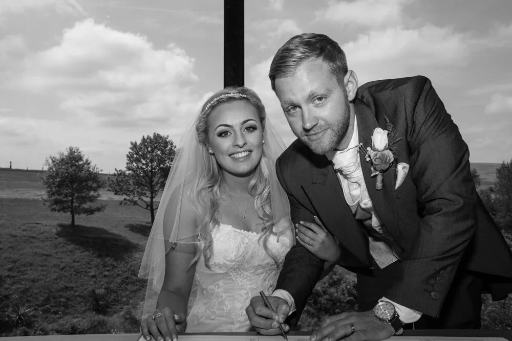 Newlyweds at The Fishermans Retreat sign the Marriage Registry