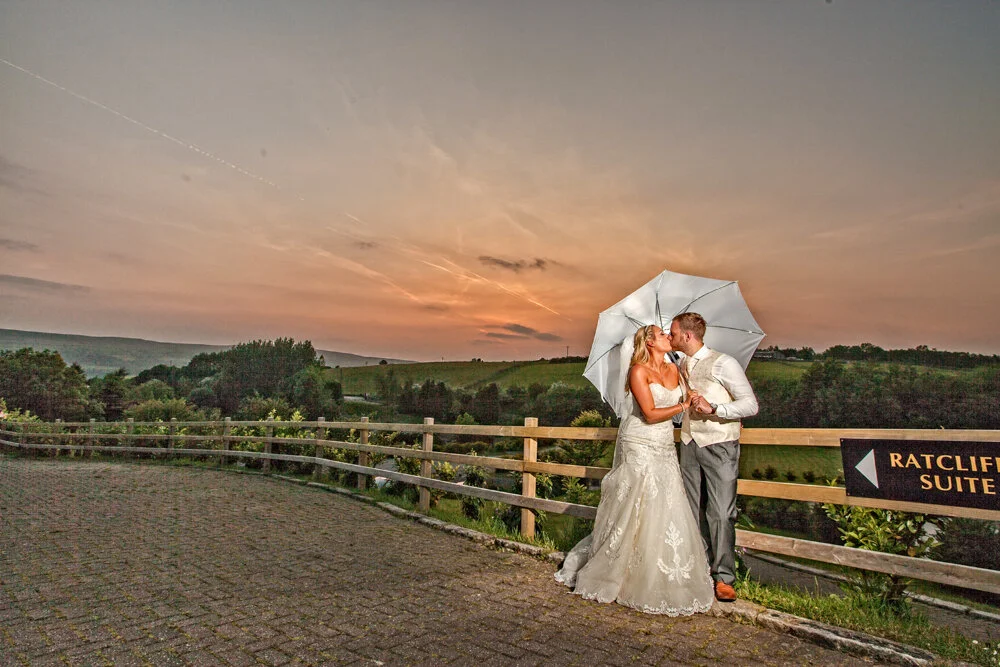 Bride and Groom pose at sun set at Fishermans Retreat,Lancashire