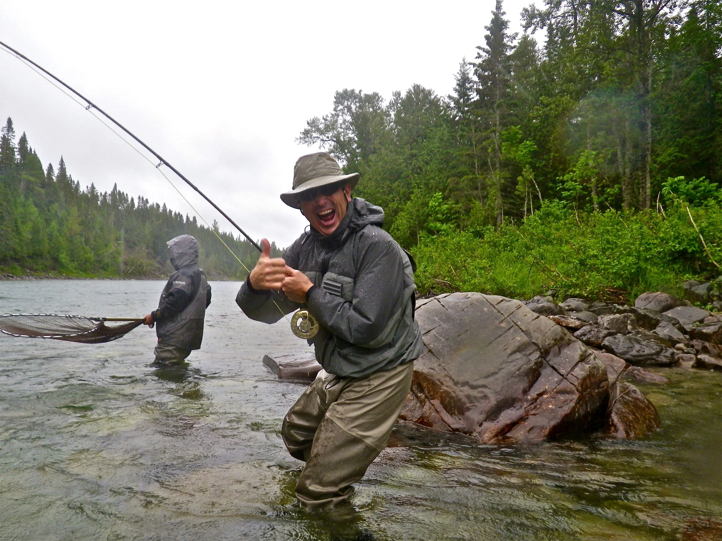 A very happy fisherman! Patrice Giroux with his first salmon of 2015, congratulations Pat.