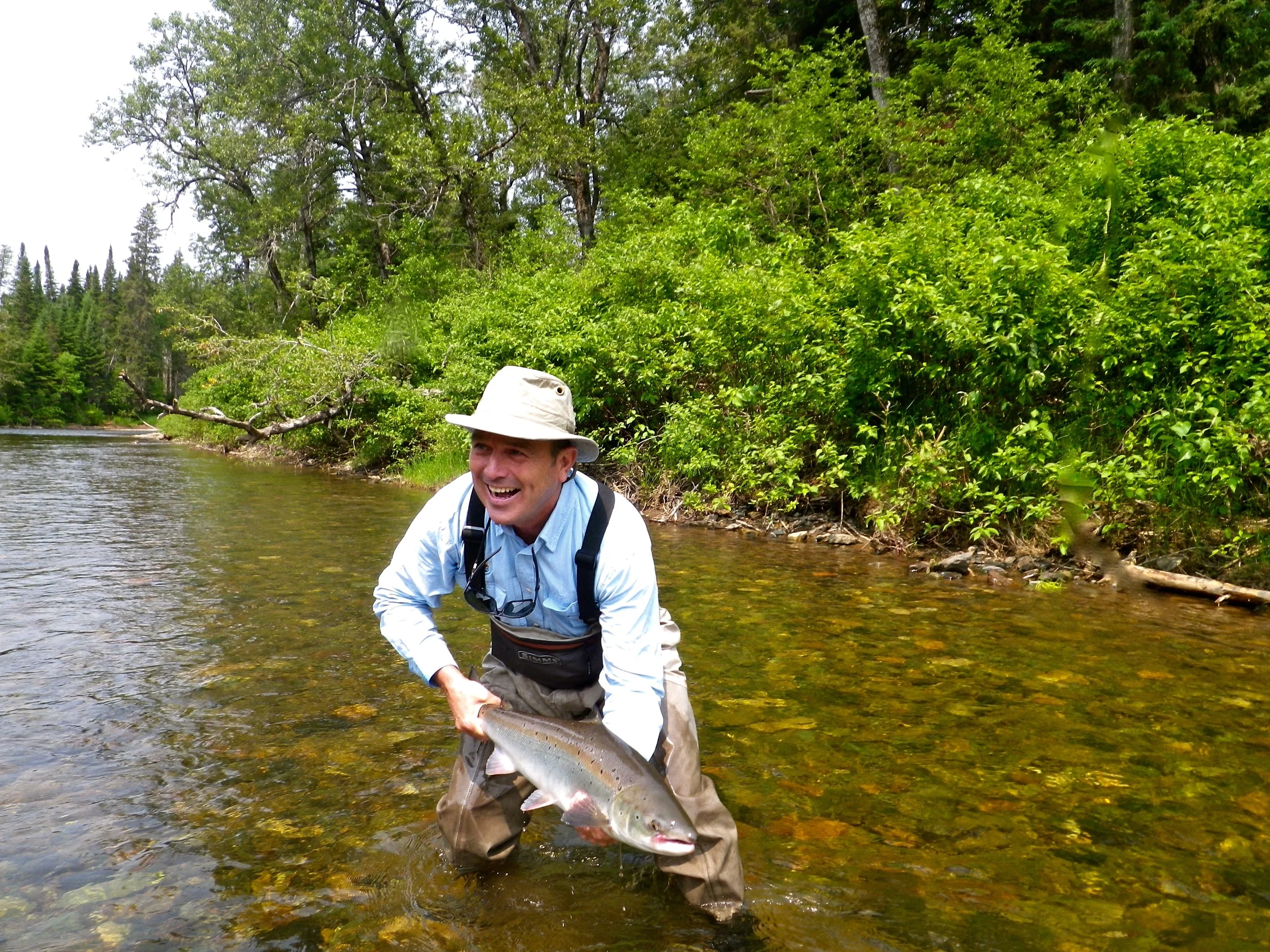 Claude Lachance puts a nice back on the Grand Cascapedia, Nice fish Claude!