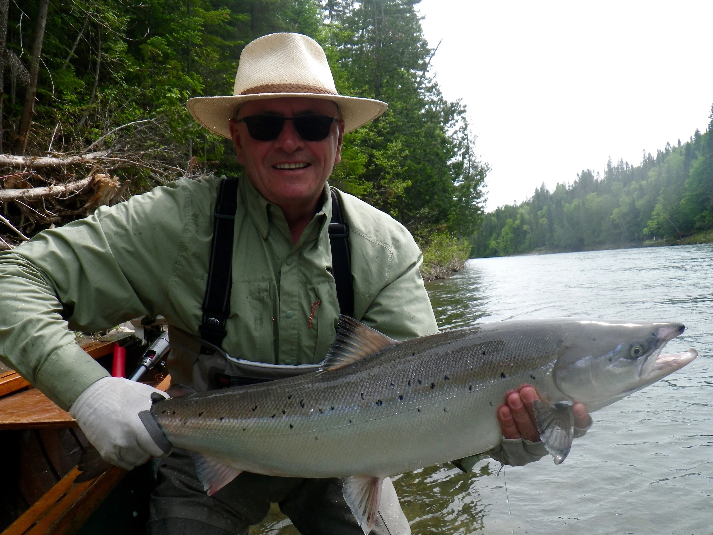 Camp Bonaventure regular Mike Barnaby lands a beautiful salmon on the Bonaventure, Congratulations Mike!