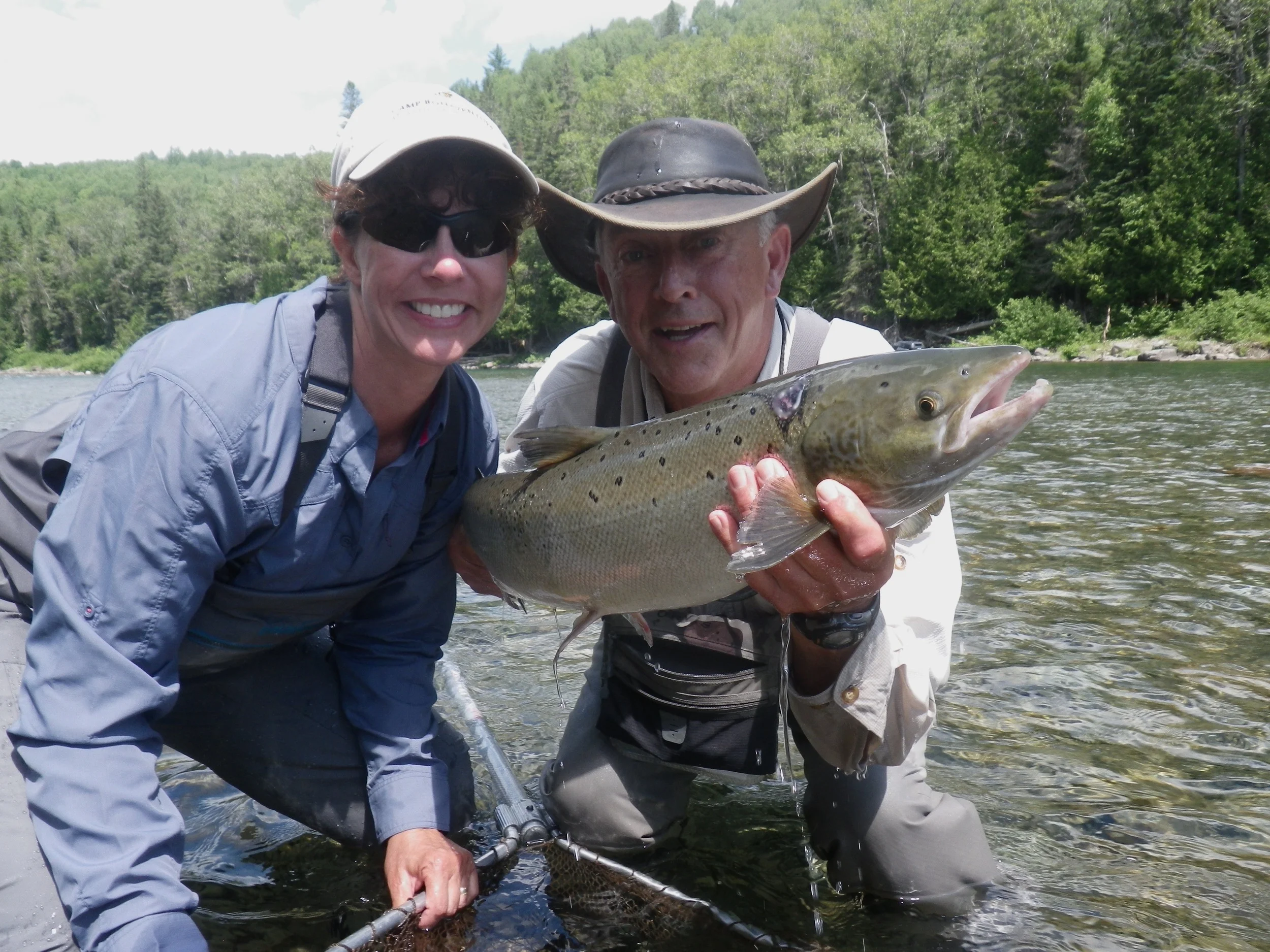 First time Atlantic salmon angler Jessica Vedeler landed this fine salmon under the guidance of guide Jean-Marc Poirier, Congratulations Jessica!