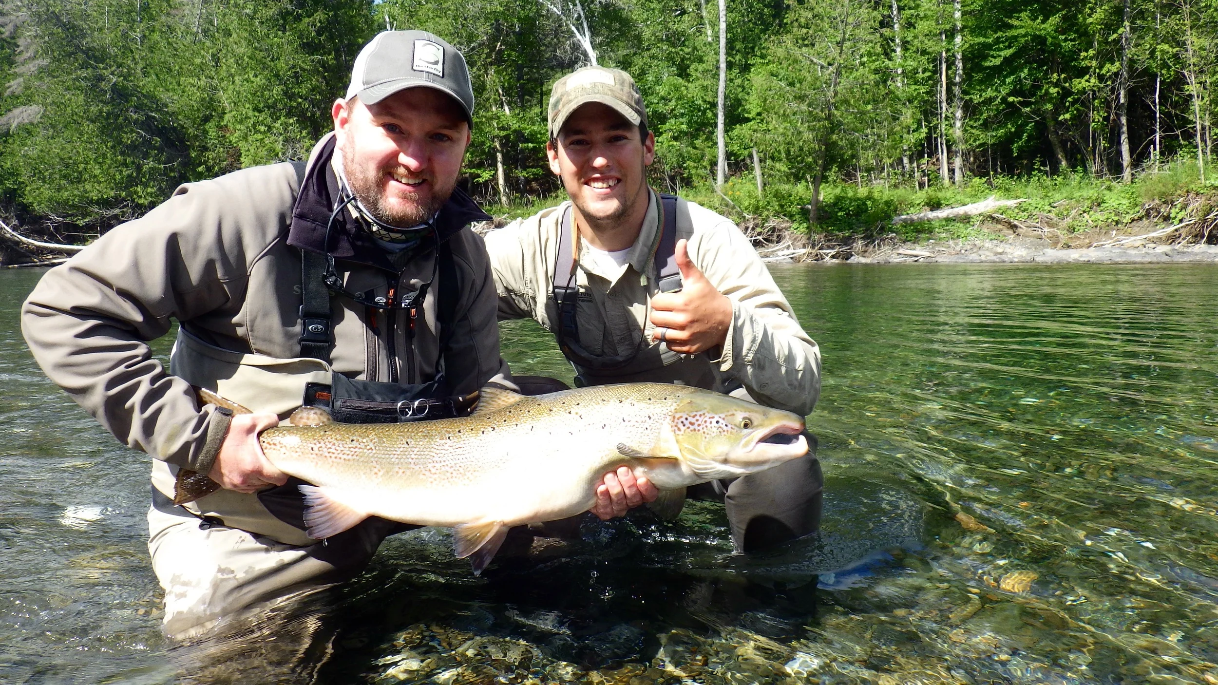 Matthew Gordon (Left) and Camp Bonaventure guide Robert Benwell pose with a nice one from the Petite. Nice salmon Matt!