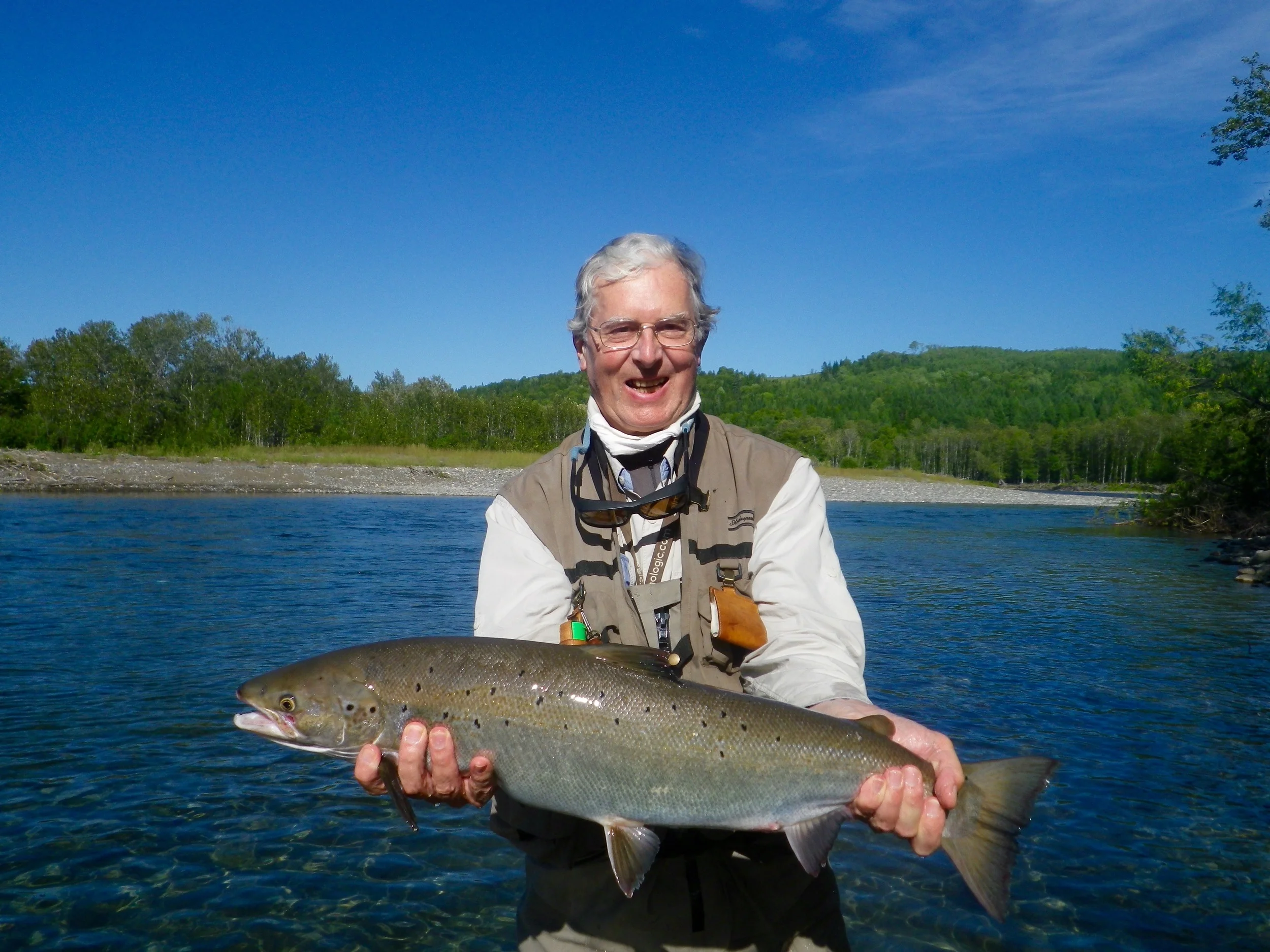 Tim Ingram has been coming to Camp Bonaventure and salmon Lodge for many years, A great angler as he shows off his Petite Cascapedia salmon!