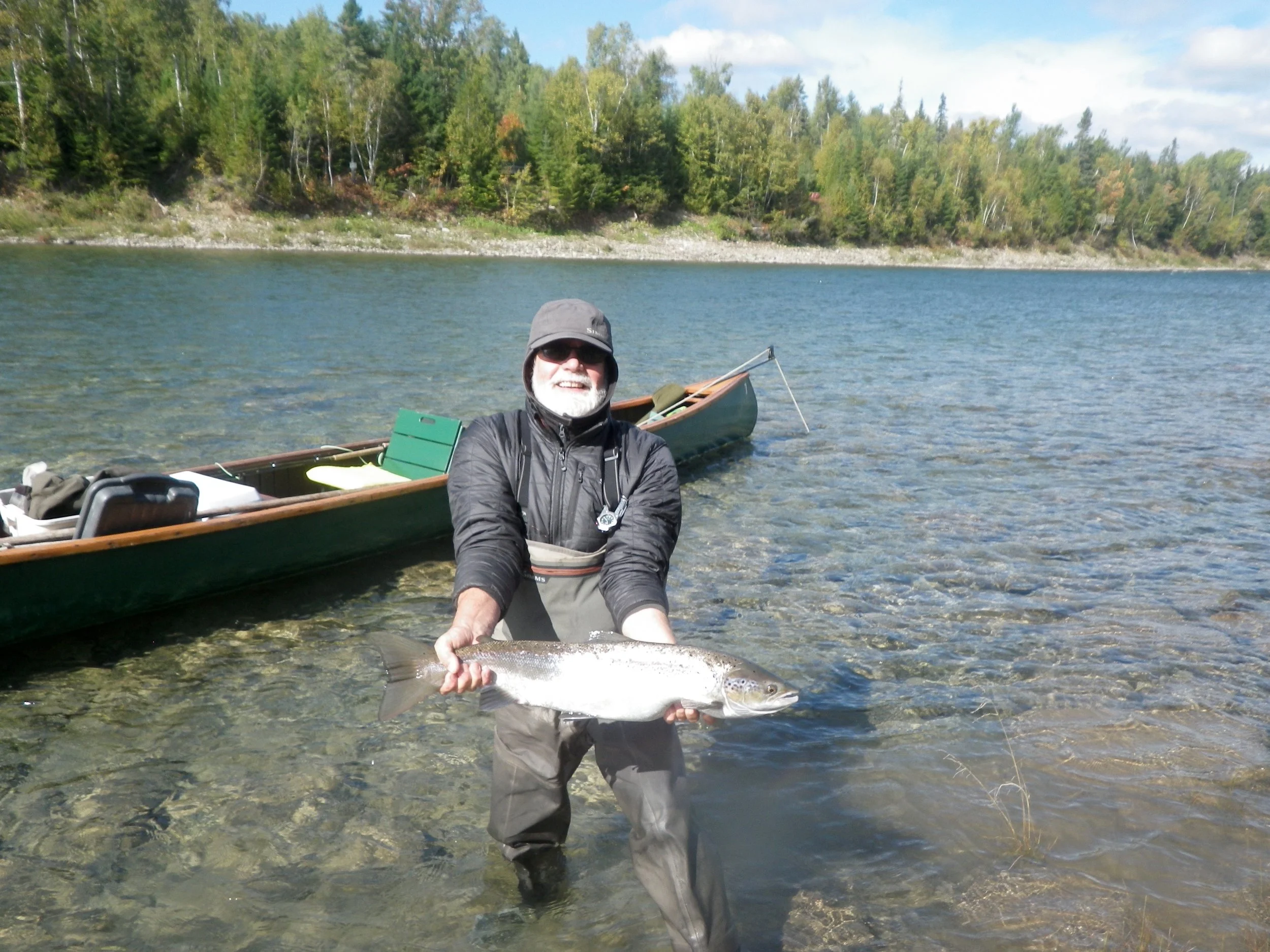 Camp Bonaventure regular Randy Spencer with a fresh run September salmon on the Bonaventure. Congratulations Randy!
