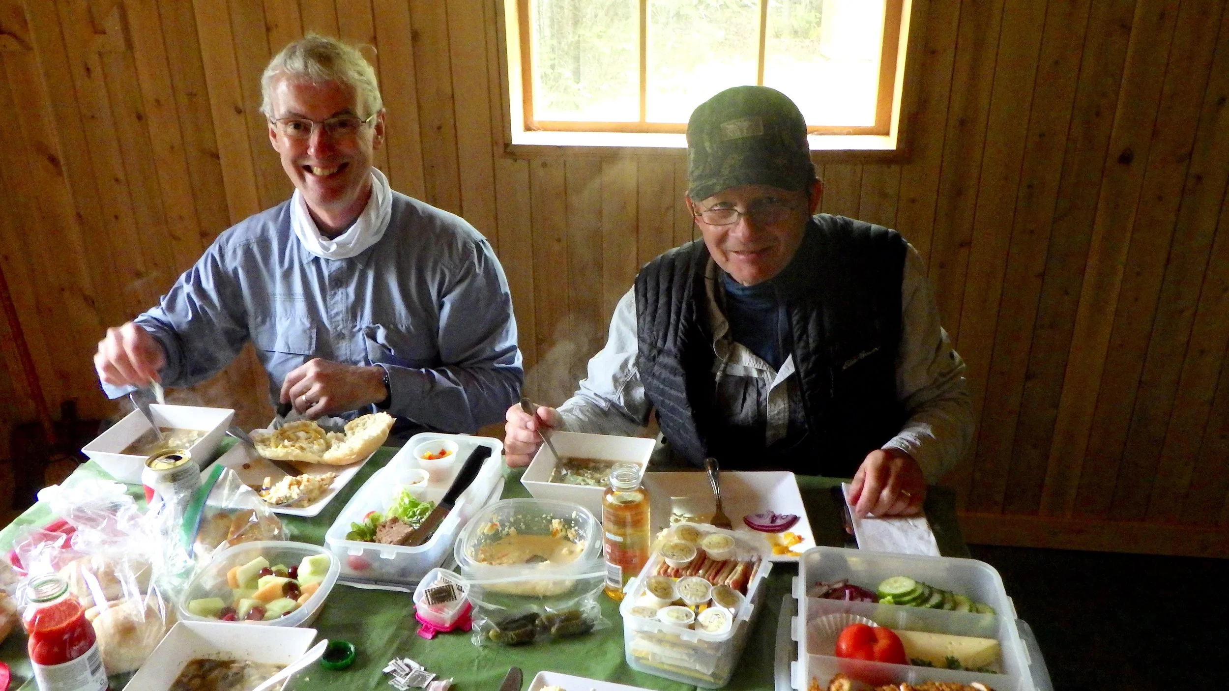 Fishing buddies John Wemekamp and Jack Gustafson enjoy a nice lunch and a short break from he cold water.