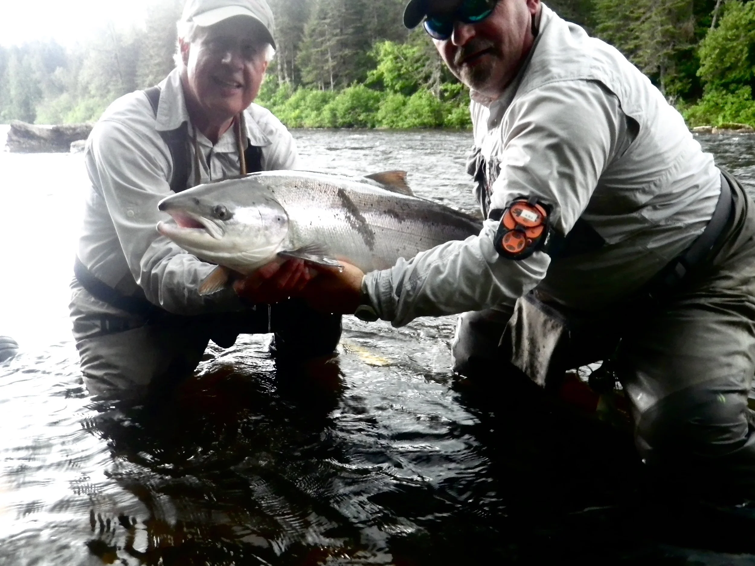 Camp Bonaventure regularJonathan Director (left) and master guide John Law with a beautiful fresh run salmon, congratulations Jon!