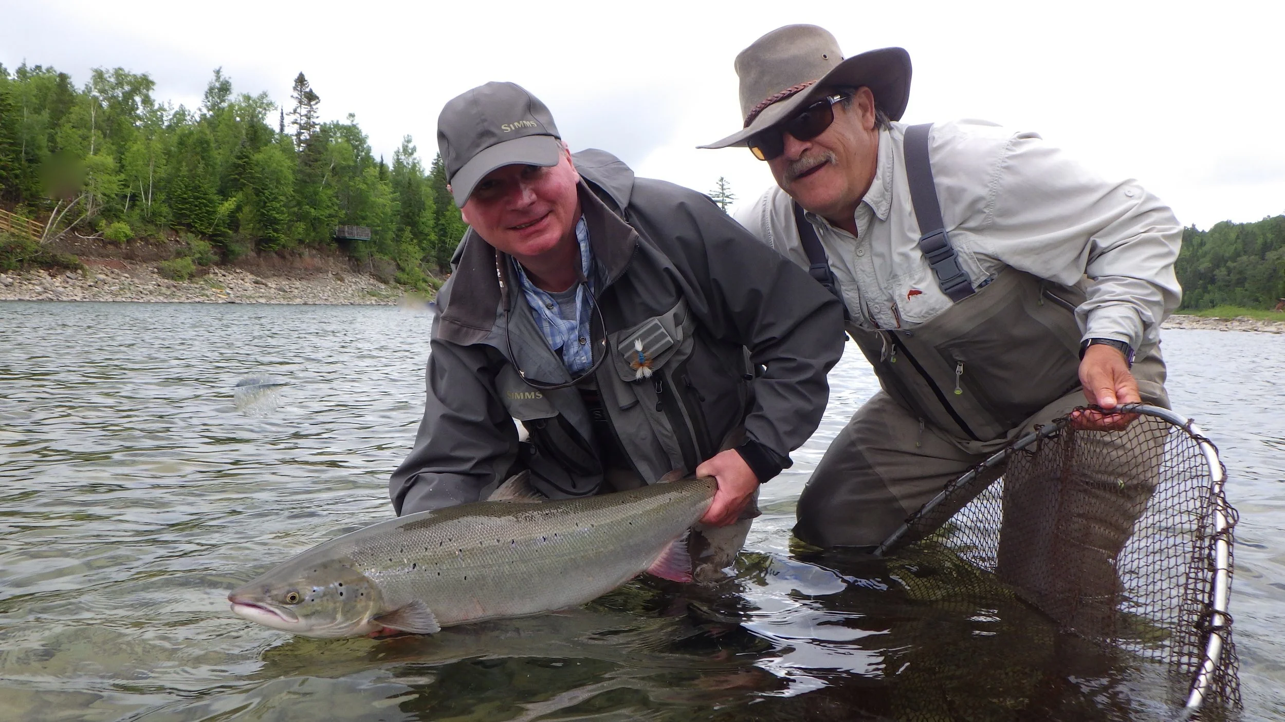 Marc Turcotte (right) has beenjoining us at camp Bonaventure for years, He and guide Mario Poirier landed this nice one after loosing 5 in a row! Finally one in the net !