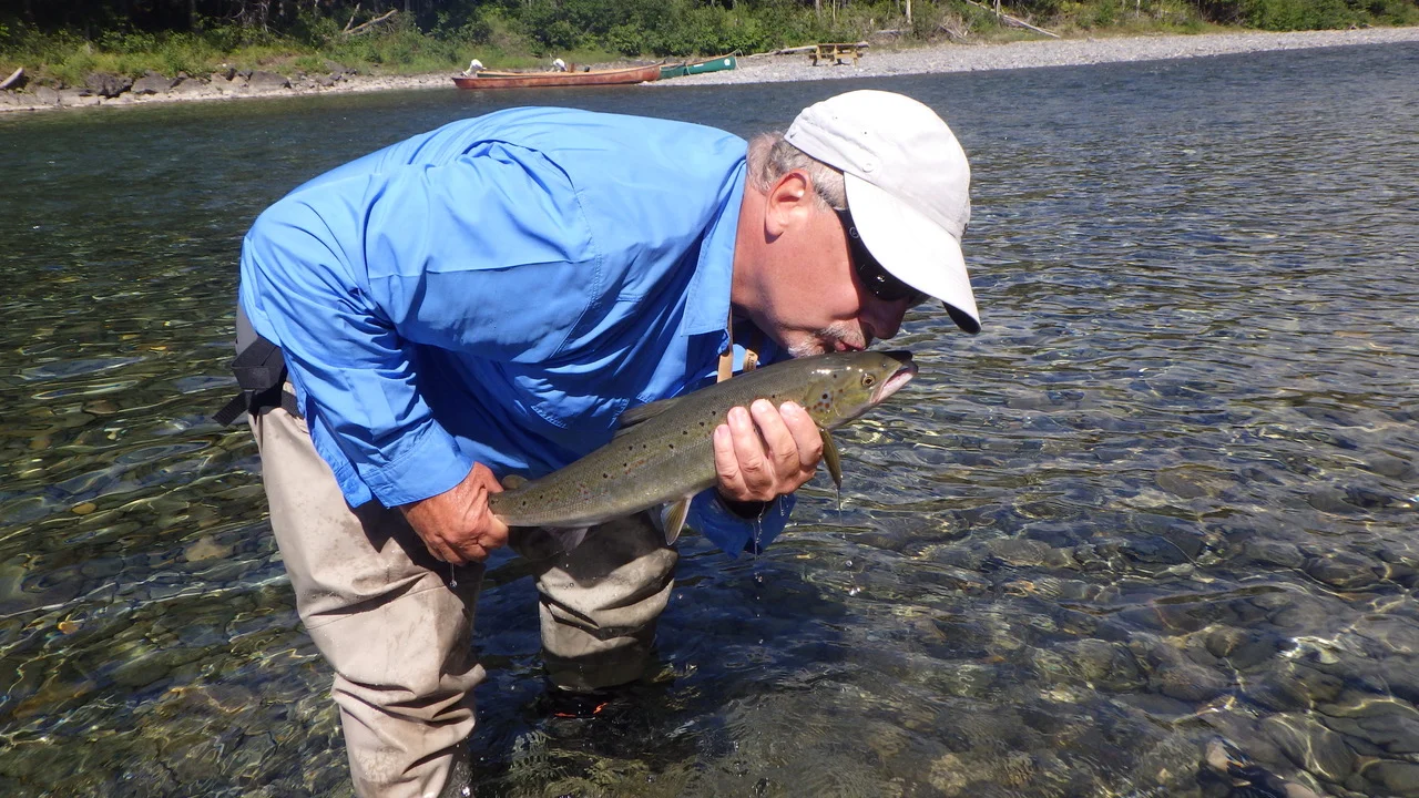 The great Gaetan Joly kisses his grilse goodbye before releasing him back into the Bonaventure River! Until we meet again my friend! Bon Voyage!