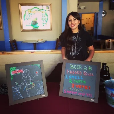 Merlin's wife Milaurys serving Shezmu at the Competition.