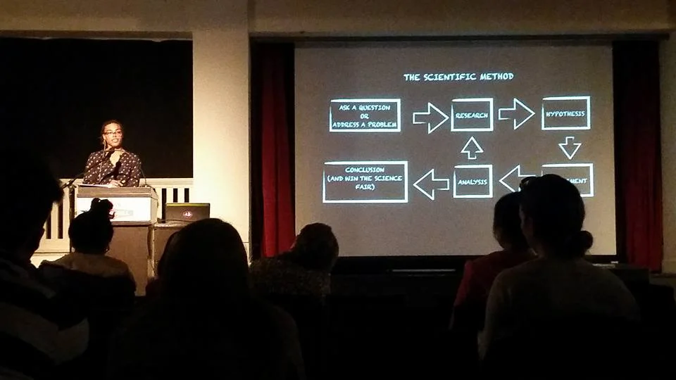 Lyles presenting at Town Hall. Photo by Kayla Boyes.