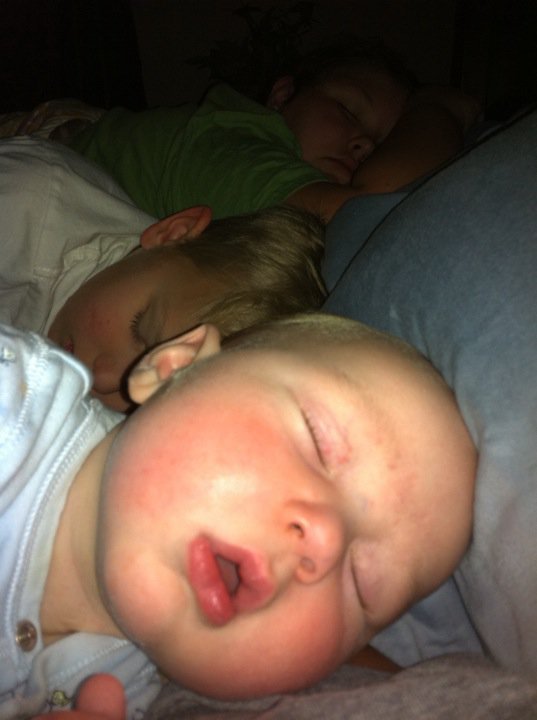  Three kids piled up in my bed the night before James got home.