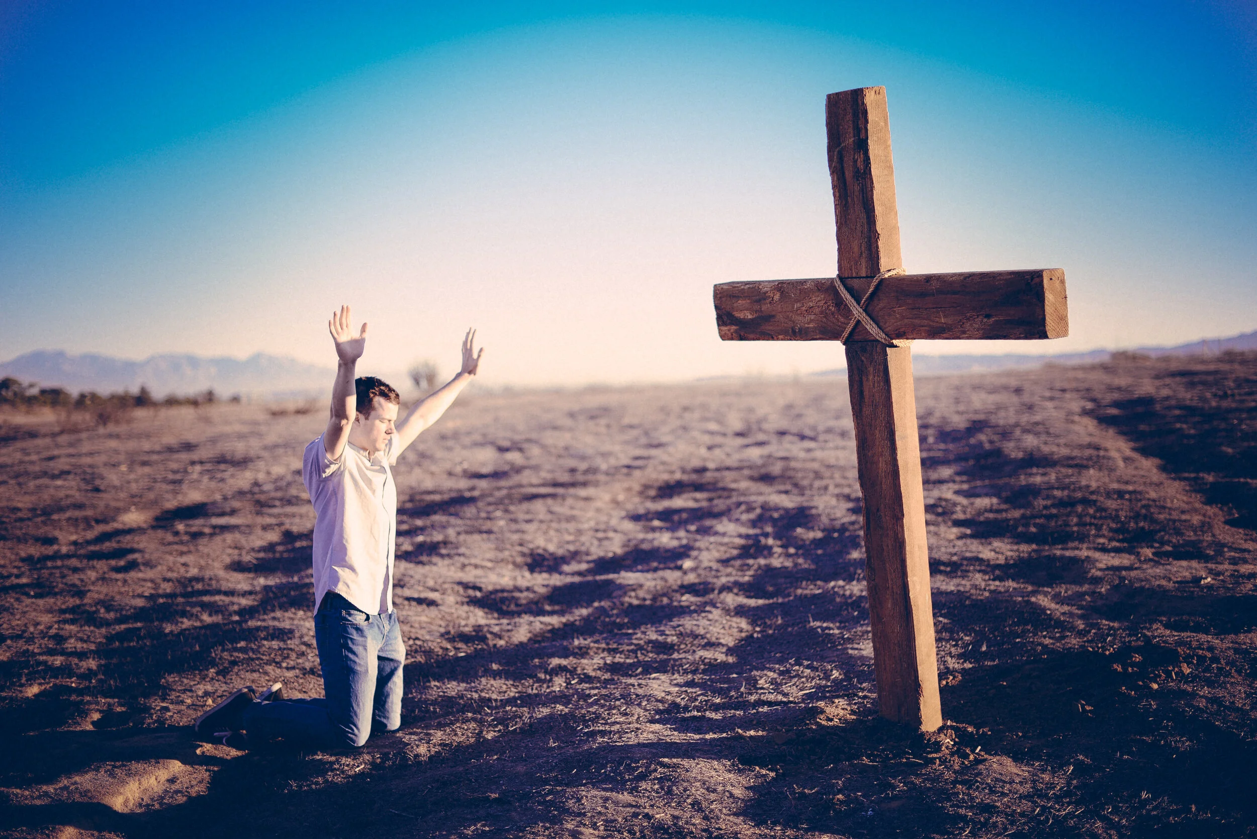 25235_hands_raised_to_cross.jpg