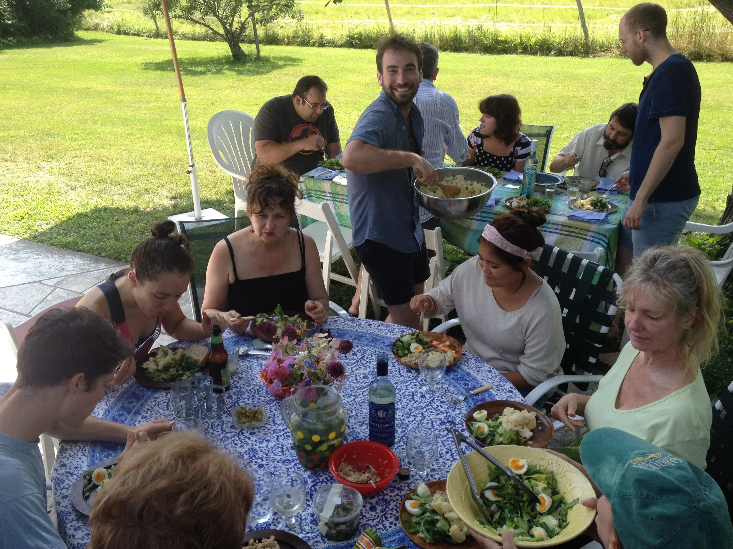 The cast and crew of The Cherry Orchard eating lunch al fresco.