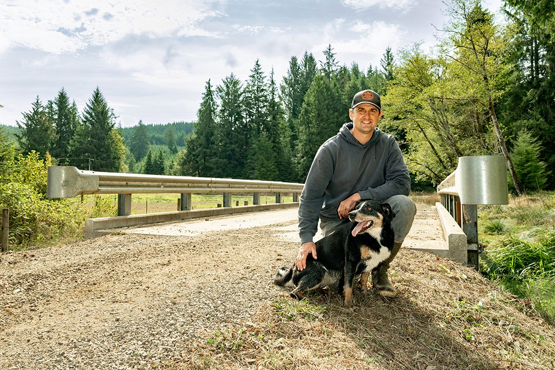  Happy landowner, Sam Mulder (with his dog Luna), on the bridge of completed SSH Sutton Creek project. 