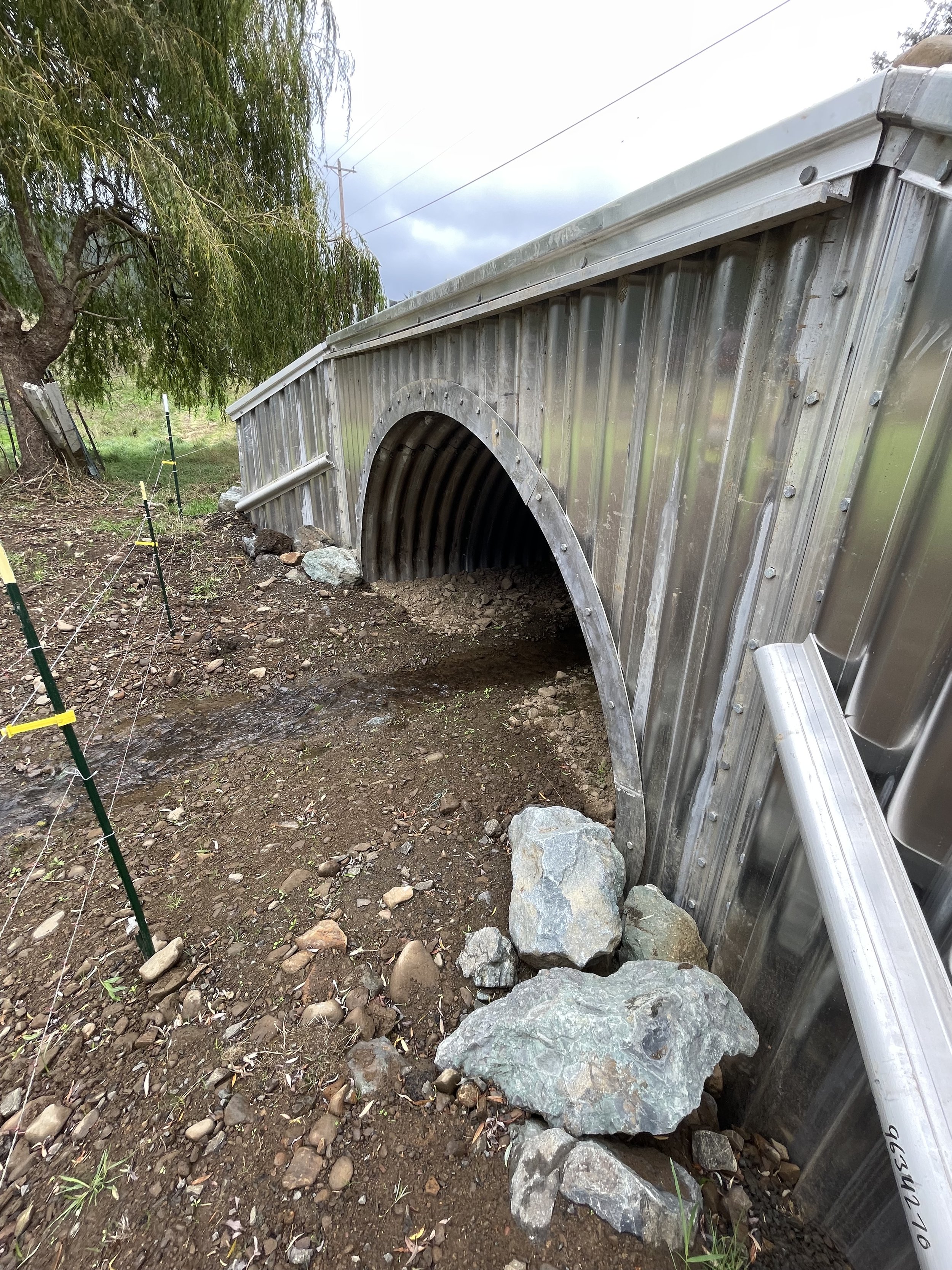 looking at new arch pipe culvert from below.jpeg