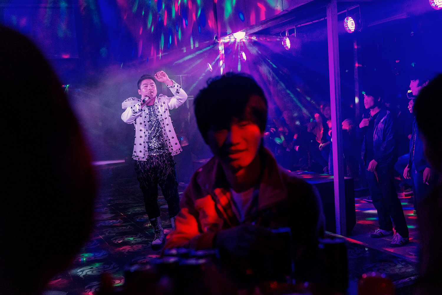 During a performance, at a club, in Foxconn factory town on the outskirts of Zhengzhou.