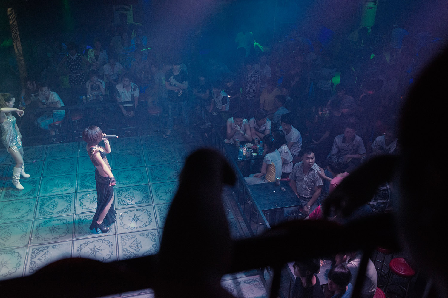 Foxconn workers watching a show at a club