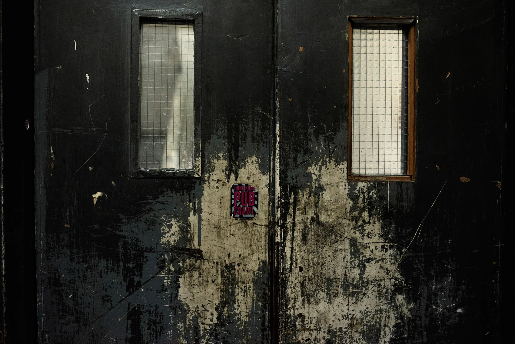A door on a upper floor of the Chungking Mansions.