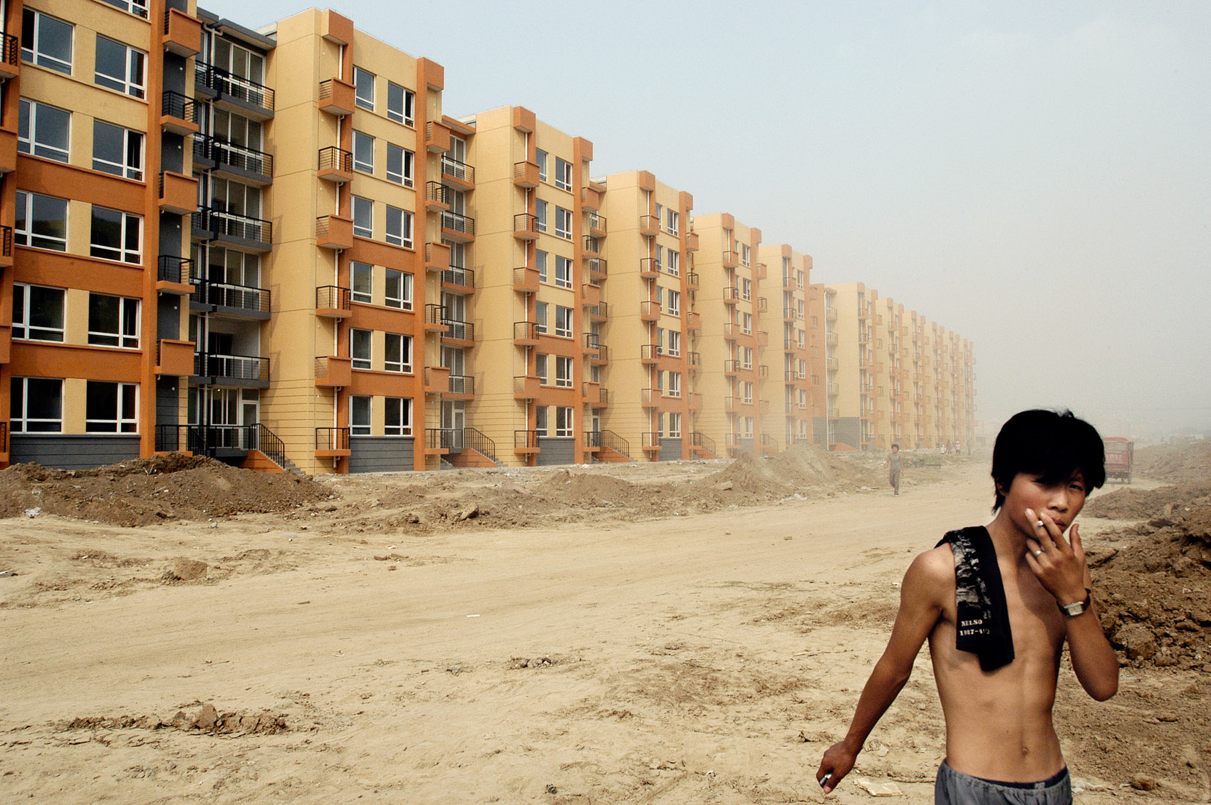A worker by a construction site in Beijing. 