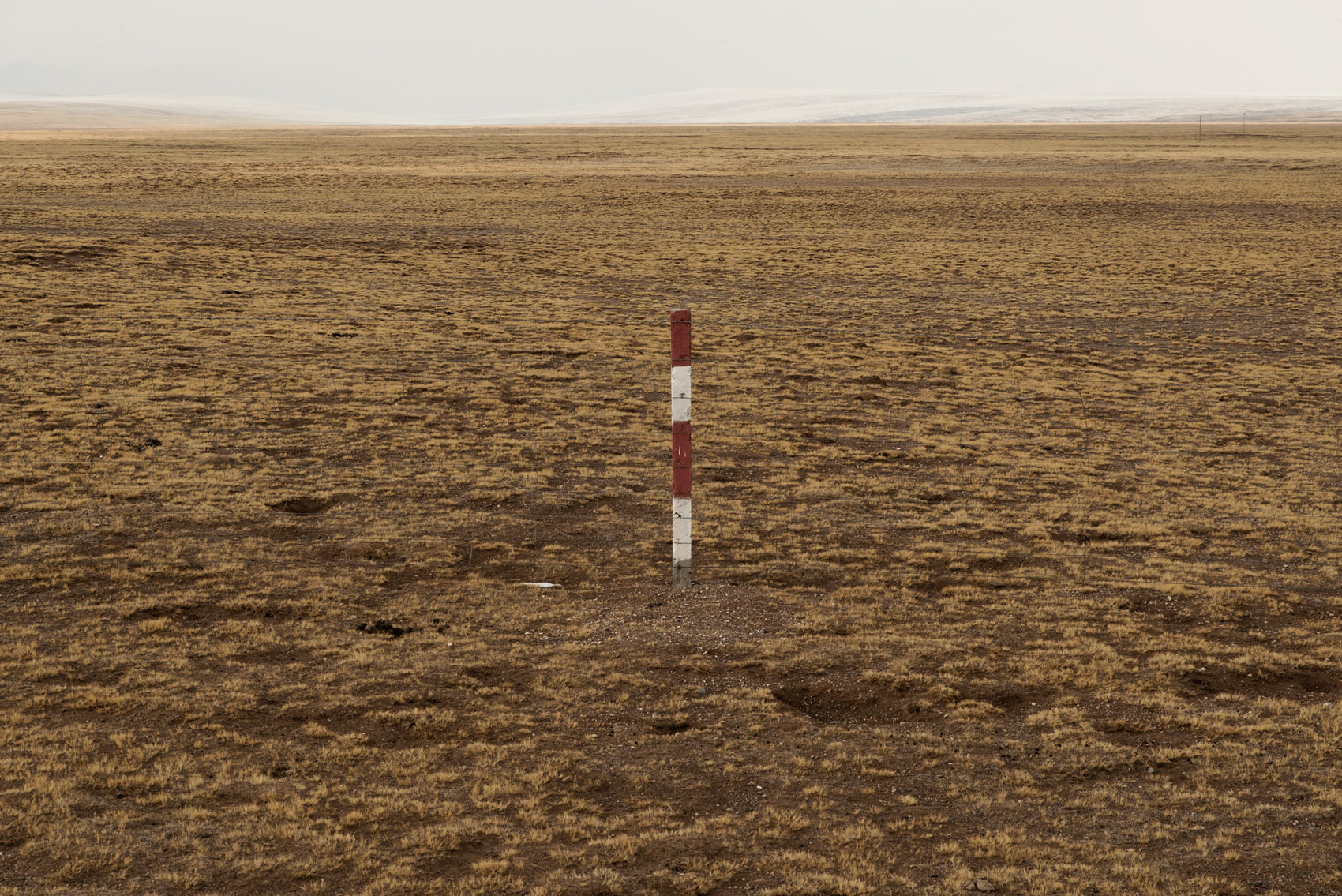 Fence in the grassland of the Sanjiangyuan reserve. Fencing has been one of the first government policy implemented to control nomadic populations. Prior to this policy, grasslands where communally managed by the nomads. Through fencing, each nomad family was allocated specific grazing area which was fenced with government subsidies, a first step in the sedentarization of mobile populations. Fencing has proved deeply unpopular, and led to an upsurge of local territorial conflicts over grazing rights, including major conflicts that have led to fatalities. Moreover, scientists argue that fencing off pastureland doesn't curb soil erosion as grazing is part of the eco-system and contributes to the sustainability of the flora and fauna. 