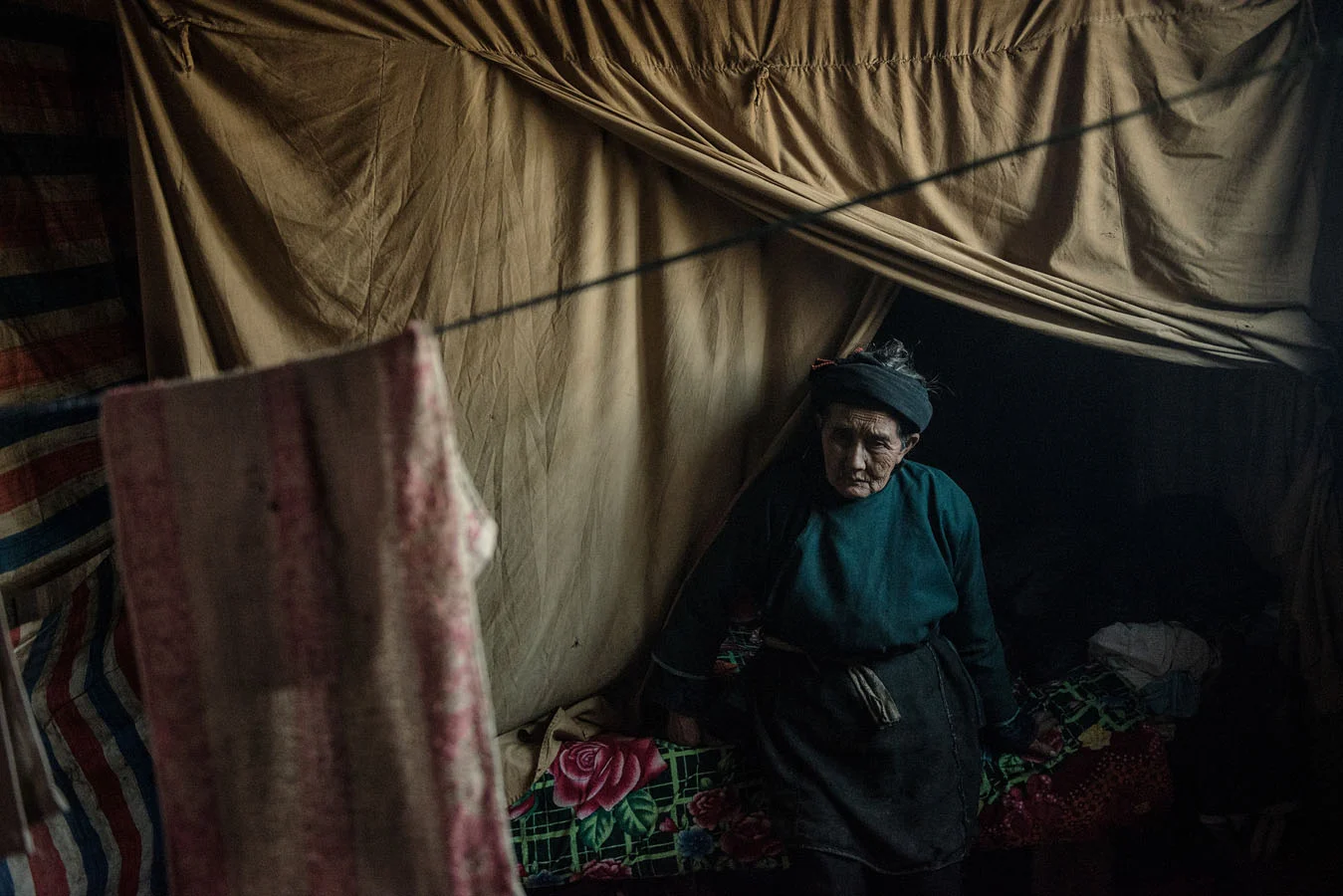 iang Gifen, who is 77 and lives nearby, looked after her grandchildren while her son and his wife went off to find work.