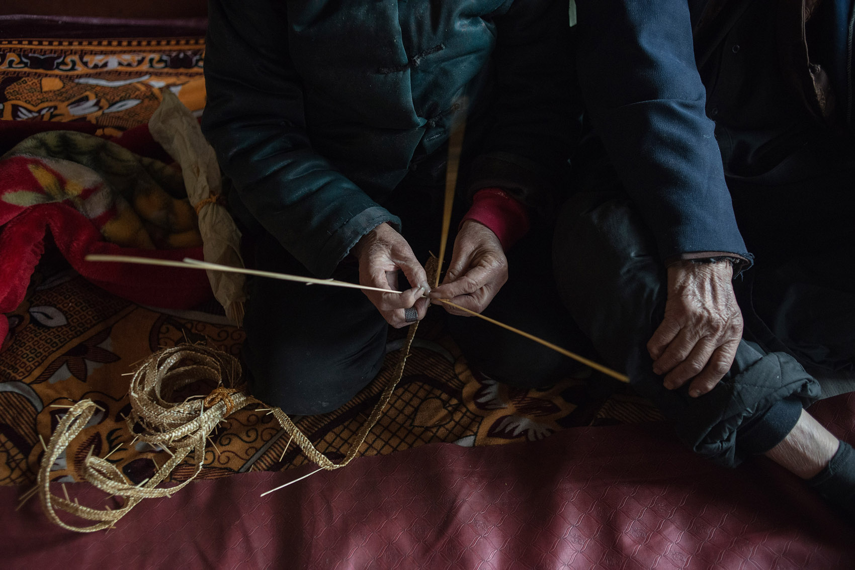 Yang Fanxiu spends her days making straw hats.