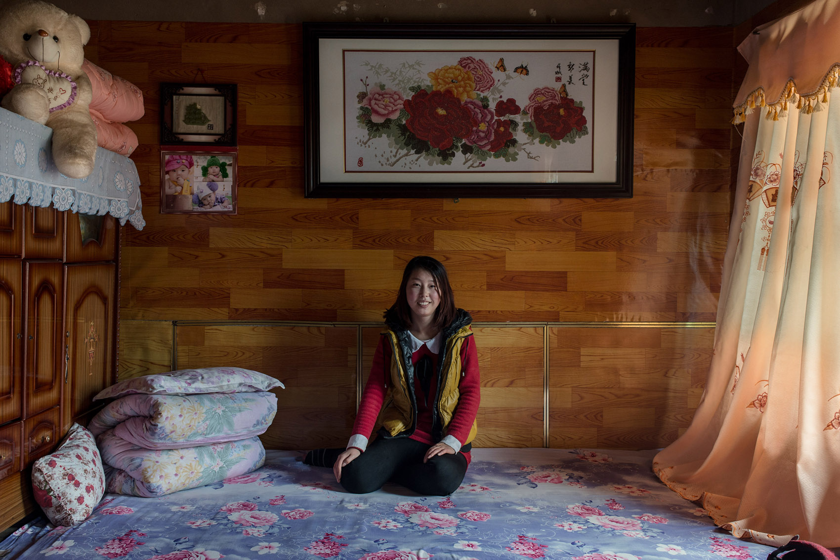 Anyuan village 22 years old Niu Taotao. Niu left her village at 17 to work in Beijing, after 3 years there she came back to her village to take care of her younger brother (their parents have died). She has a boyfriend who she was introduced to through a relative. He is is from the same county but works hundreds of kilometers away in a factory in Beijing. They only met twice and talk regularly via the internet. She is unsure about this relation and does not plan to get married before her younger brother goes to college. She prefers life in the village which she finds more comfortable and safer than Beijing. She is taking care of the small family apple orchard and enjoys watching tv during her free time. 