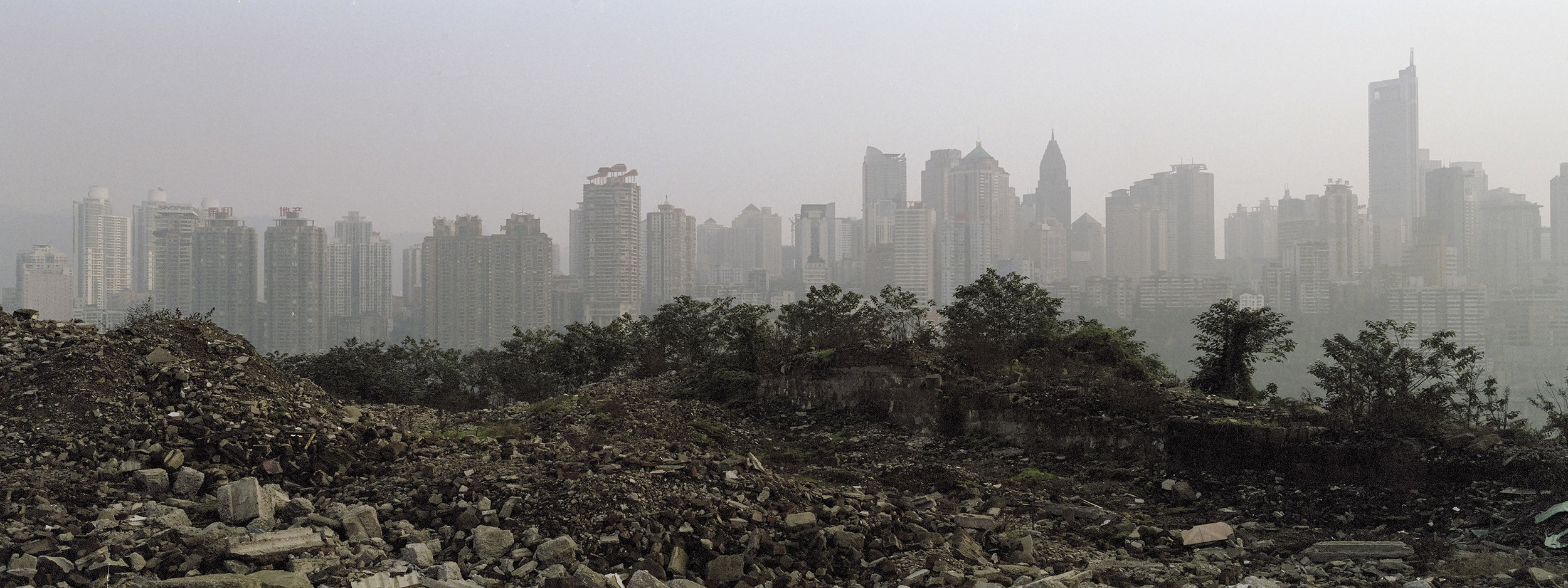 Urban landscape of Chongqing, one of the fastest growing city in China. One of the founding element of China's transformation over the past decades has been the urbanization of its population.. The share of rural population dropped from 75% to 45% in just 25 years. Hundreds of millions of people moving and drastically changing their lifestyle.. This phenomenon has triggered a total reshaping of China's urban landscape. Historic neighborhoods have been razed to leave room to high-rises and shopping malls. Alleyways have become expressways. Meanwhile this influx of population has put urban infrastructures under stress, with packed buses and subways, drying water resources, and increased air pollution. 
