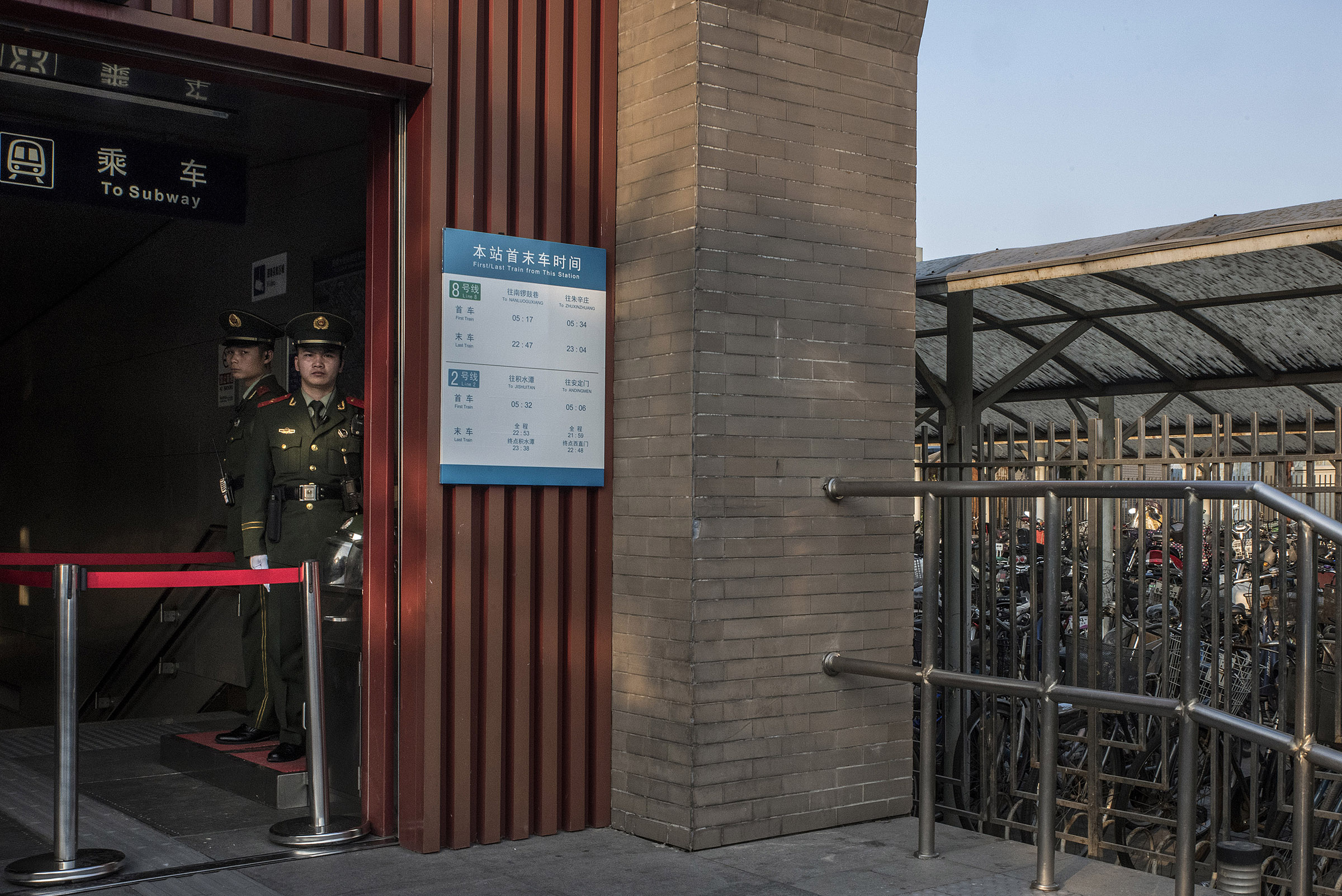 Paramilitary police at a subway entrance in Beijing. Security in the capital has been heightened for political event. Each subway entrance has two military police standing guard on top of regular police and security staff. Overpass bridges, important crossroads also have paramilitary police.