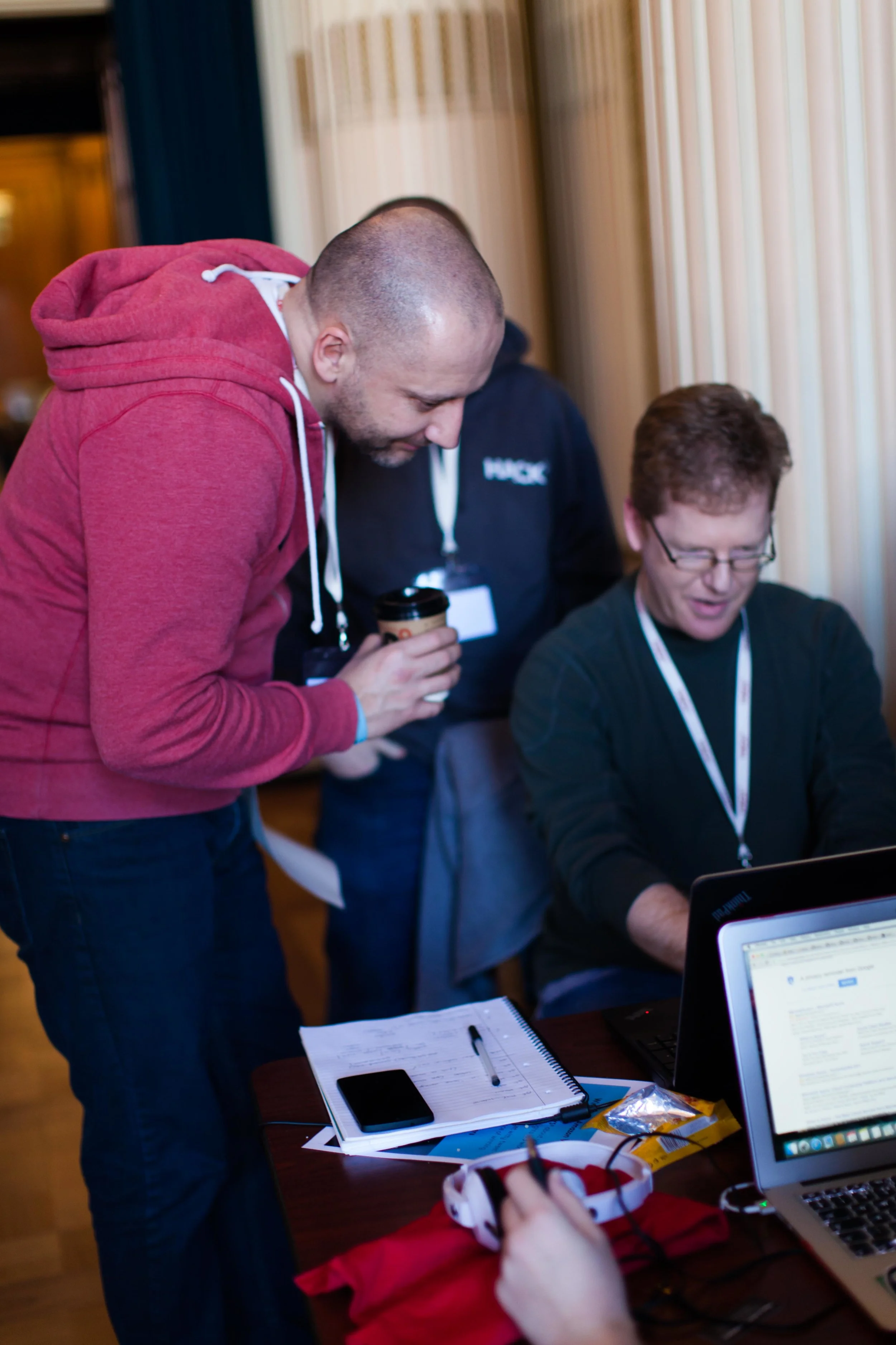 Anton Roe, CEO of MHR, chatting to hackers about their entries