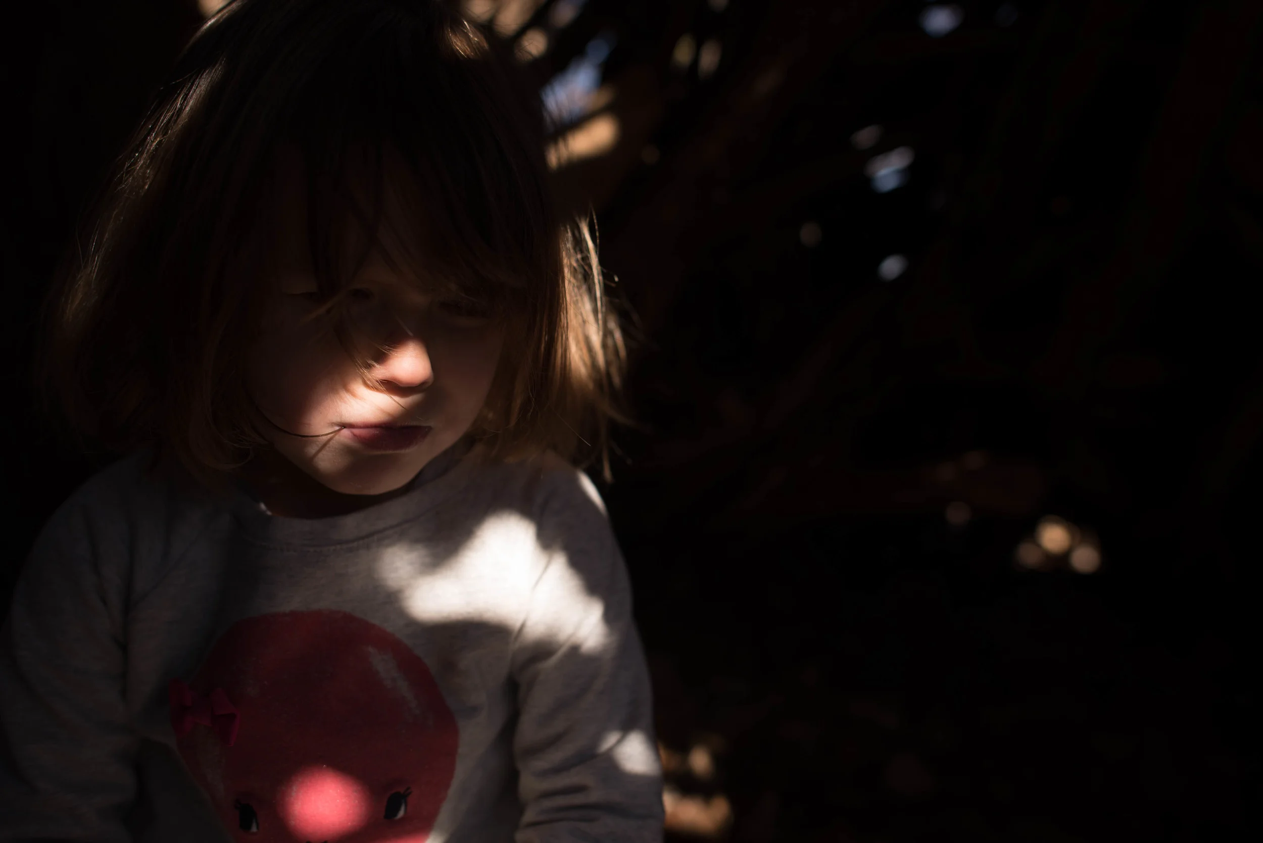  The final settings for this image is f/2.5, 1/1250, ISO 100, E/V +1. Now the fun part begins! I'm a huge fan of tight frames, so the first thing I did was to crop way in the only include her nose, mouth, and the three points of light. I don't use presets for my color images, I just have a typical workflow that I go through: add contrast and clarity (this is necessary since I shoot in RAW), lower shadows, subtle split tone, and a heavy fade. I also add grain most of the time because I dislike the perfection of digital images and prefer the feel of film...maybe that makes me weird. Anyways, here's the final image: