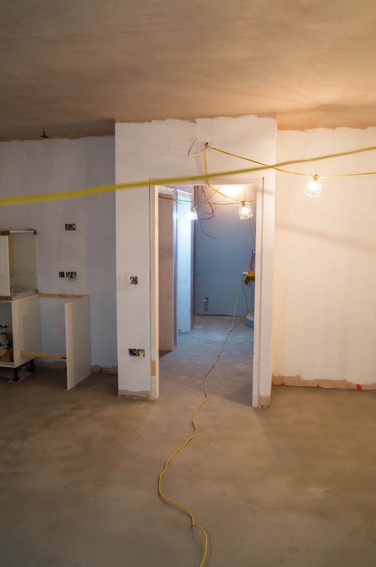Cables running in and out of the corridor leading to the new basement meeting room.