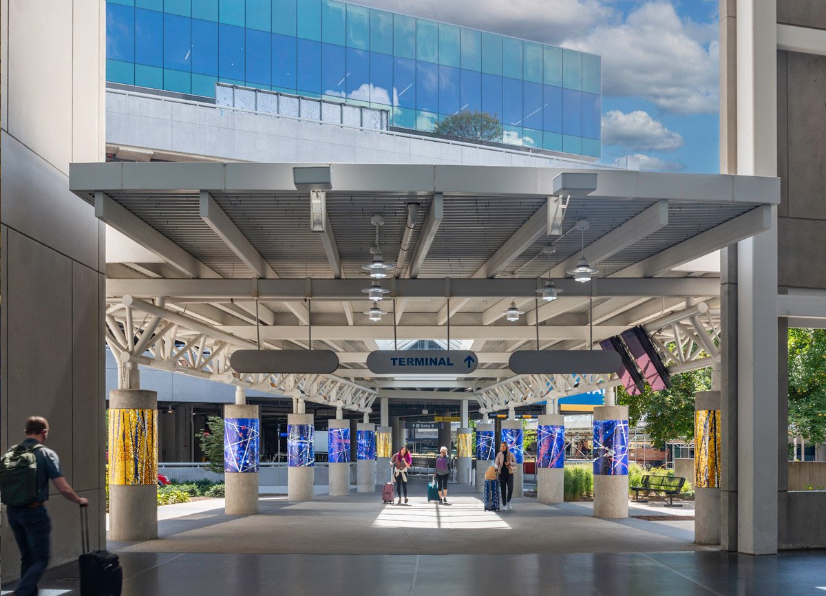 Twelve mosaic columns at entrance to rental car facility public art Nashville Airport
