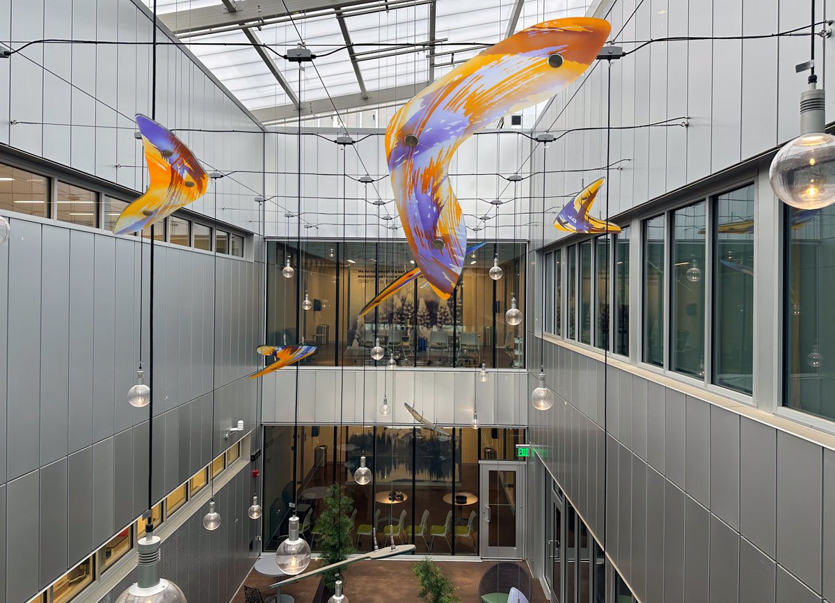 Blown glass birds flying through courtyard