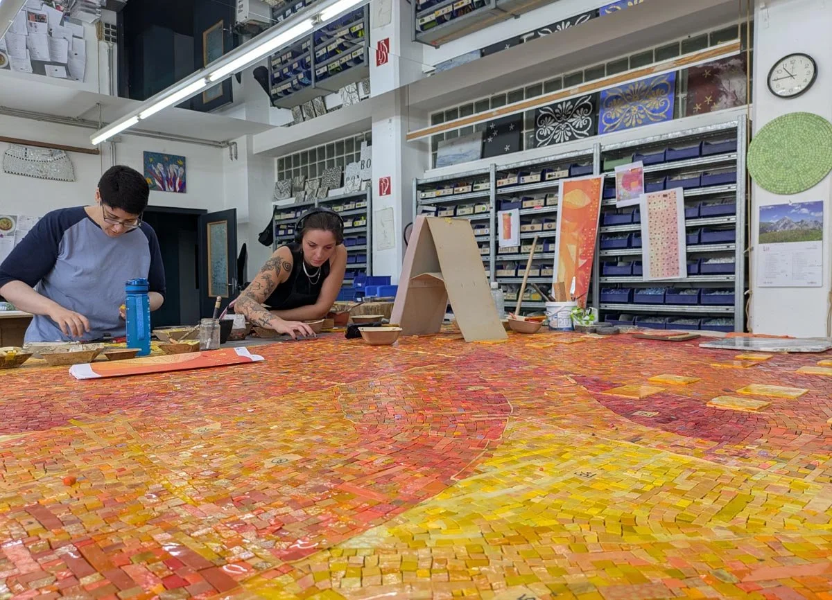 The mosaic is usually made in one piece before being cut up into smaller panels for installation