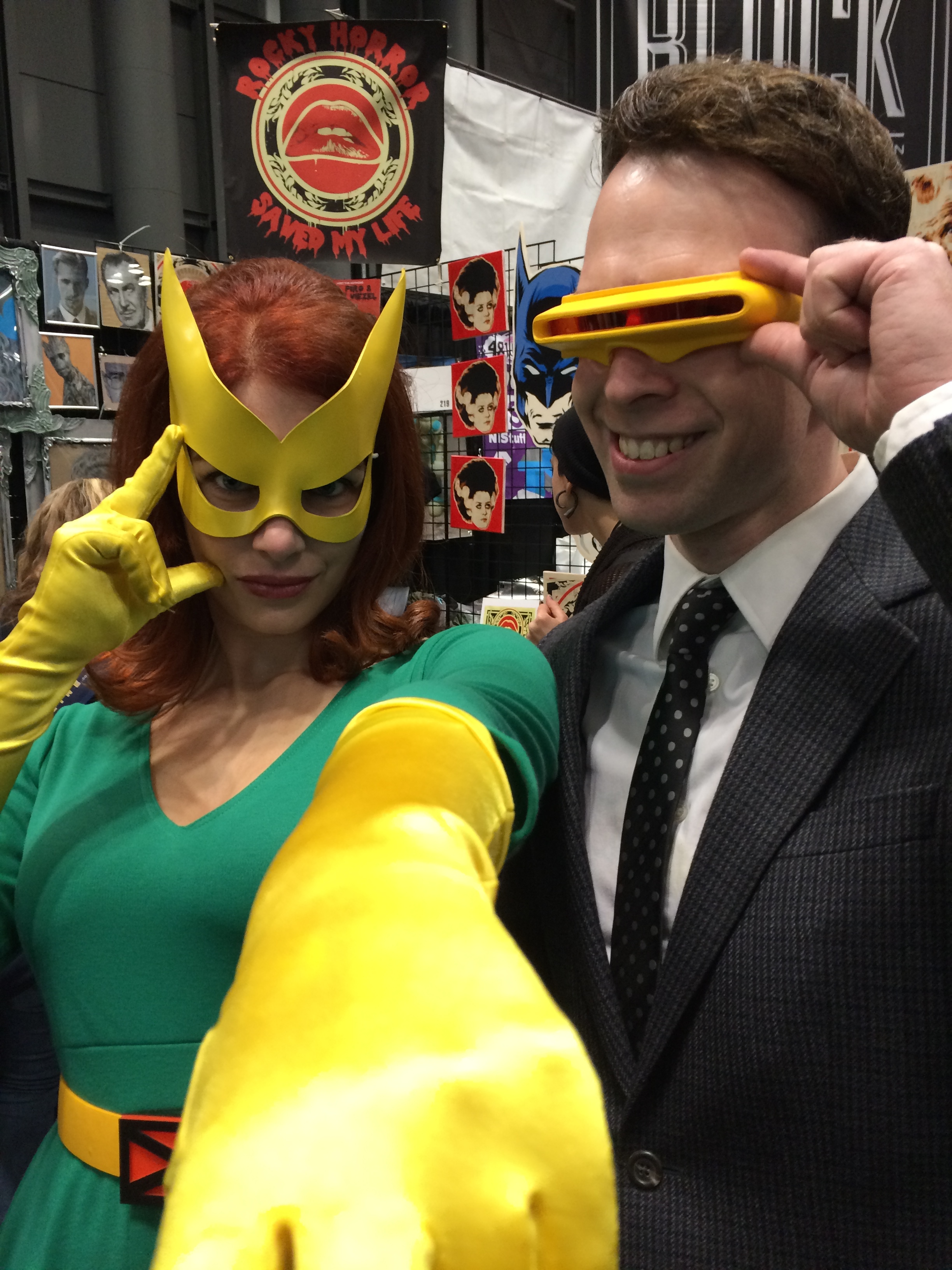 Marvel Girl (Laura) and business Cyclops (Shawn) posing in front of the RHSML and co booth NYCC '14