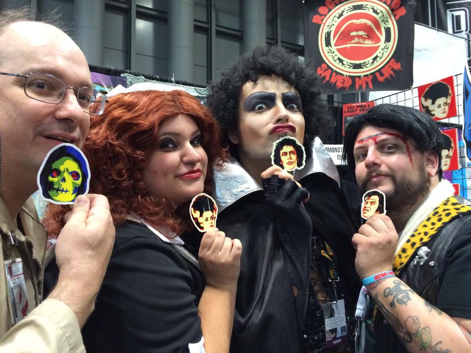 Ron (NYC Cast), Magenta ( The Home of Happiness cast member, AJ), Frank ( The Home of Happiness cast member and Producer, Paulie) and Eddie ( The Home of Happiness cast member, Kevin) strike a pose...with some epyon5 stickers at the RHSML booth! NYCC '14