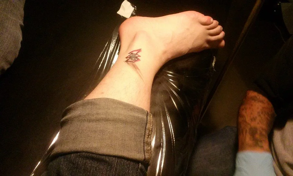 Shawn committing to this project fully. In progress of covering an old tattoo with a Translyvanian lightning bolt at El Fishnet Fiesta Dos