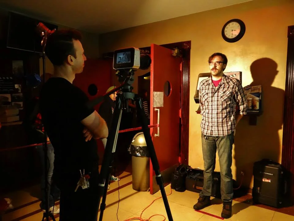 Shawn interviewing friend, former employee of the Crossroad Cinema (home theatre to NWI cast Pink Invaders) and good friend to Shawn, Ryan being interviewed during our visit to Help Me Mommy in NW Indiana (Photo credit to Magda Gomez)