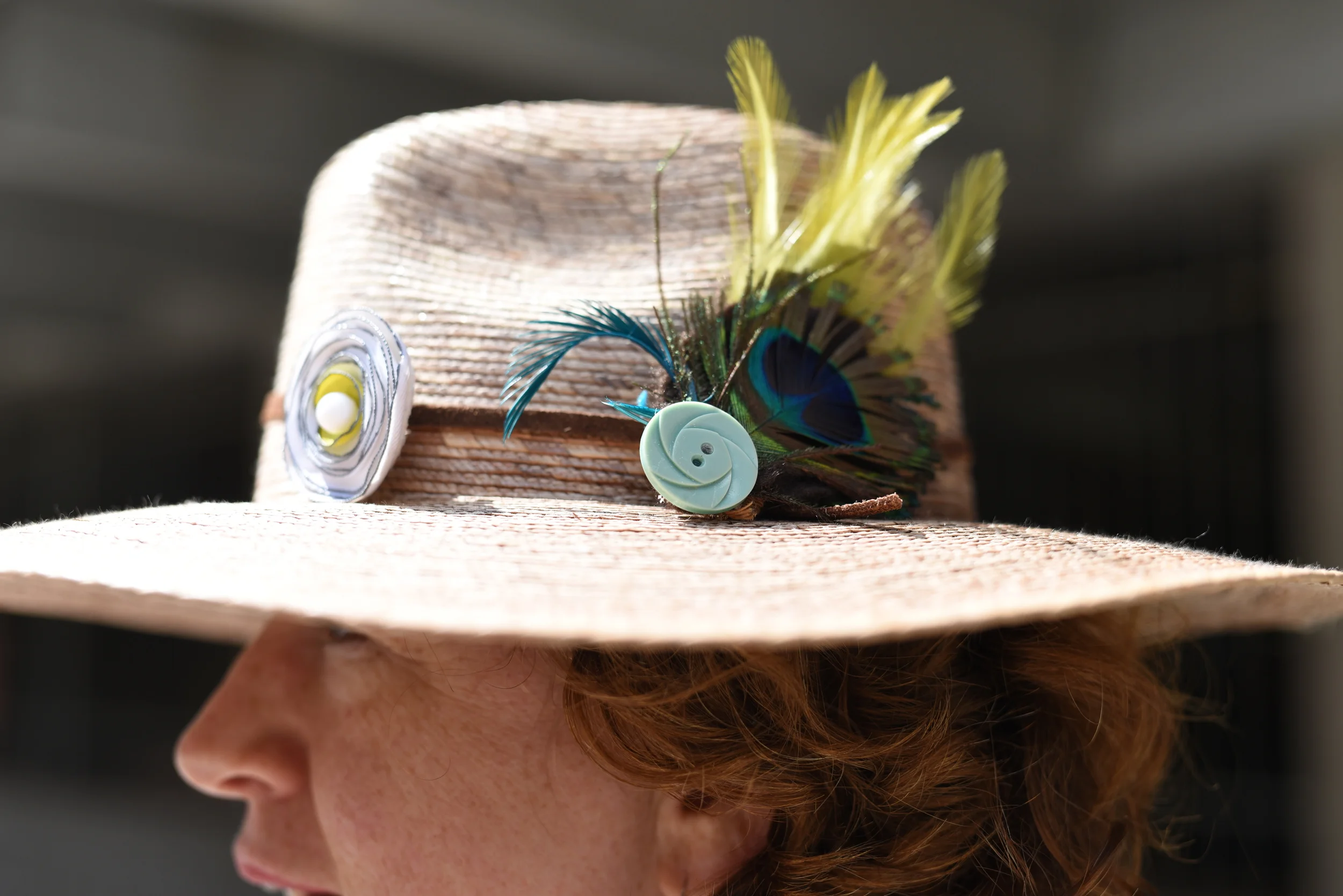 She makes hats. But not this one. She just added the peacock feather to this one. But if you want to see her awesome creations, go to www.tinakite.com. 