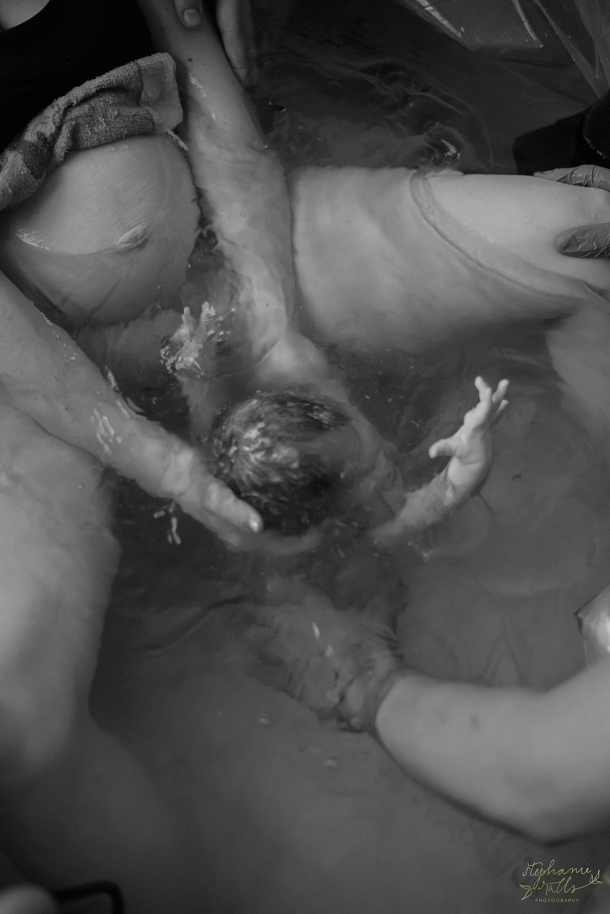 What a beautiful moment, reaching for mama as she comes out of the water! Incredible shot, Stephanie Ralls Photography! 