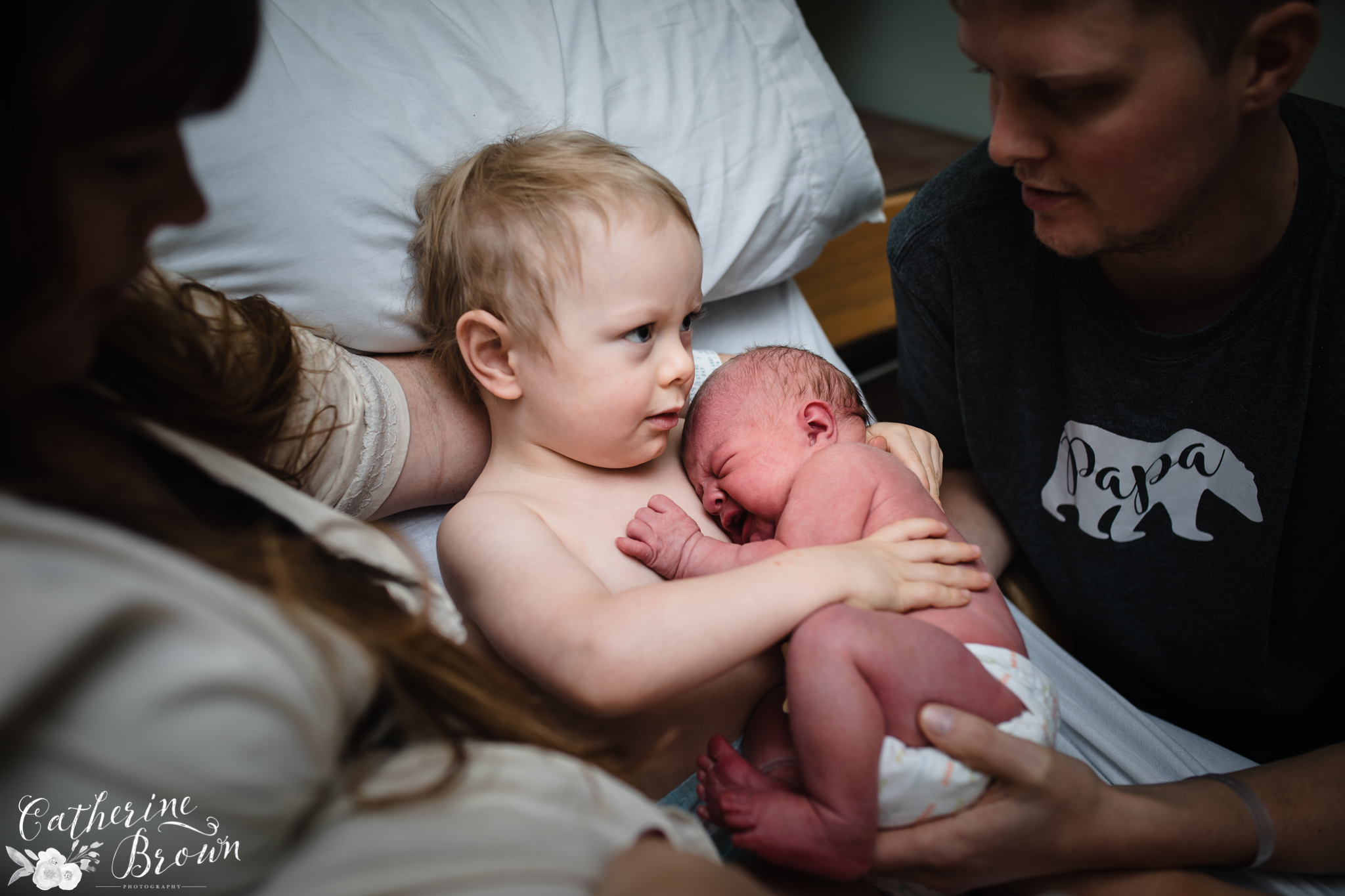 "The magical moment their two hearts met and beat together for the very first time. Skin to skin with big brother at just a few hours new. Birth can be a family event where older siblings are a part of the experience and what a life gift they are given to have birth normalized for them forever." Sacred Moments Photography